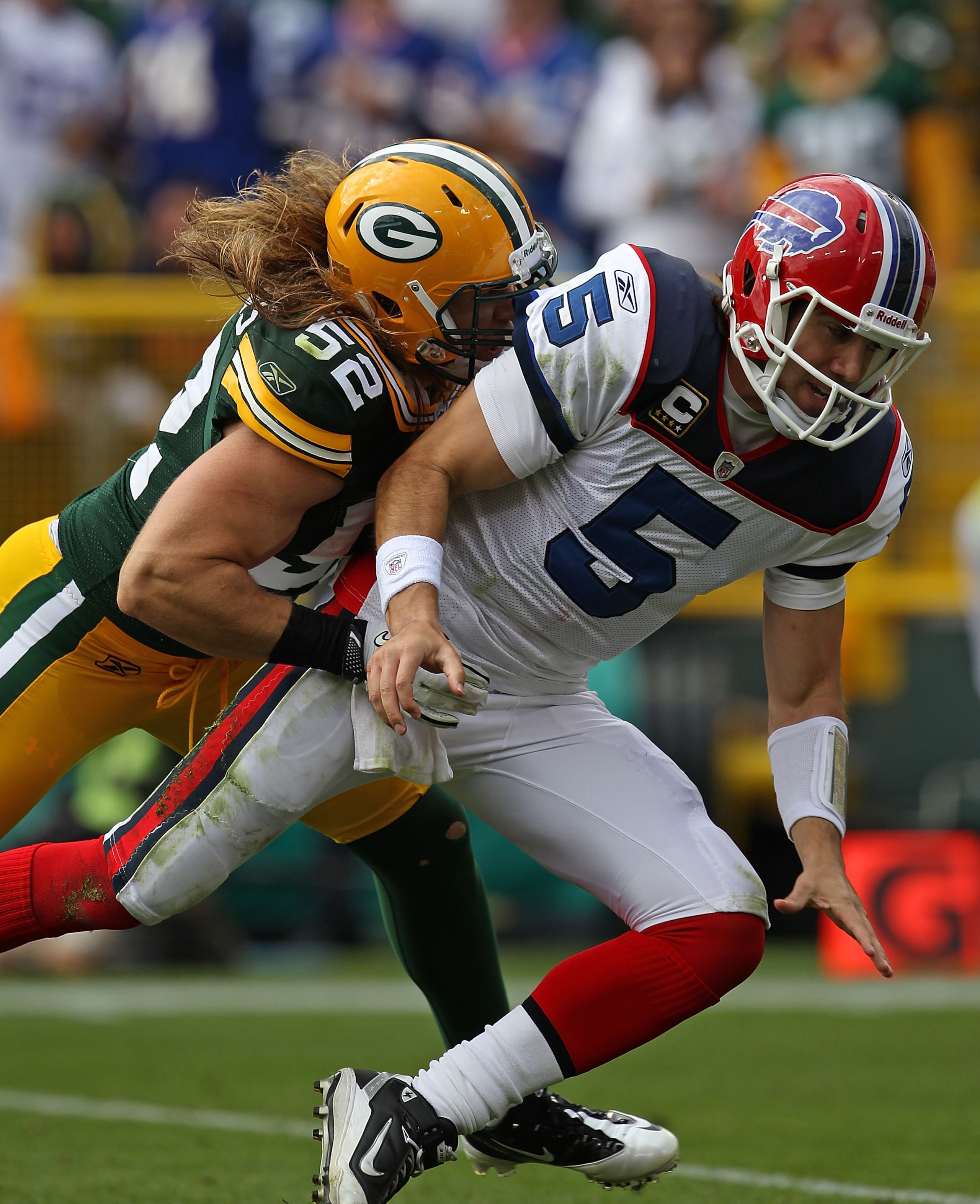 GREEN BAY, WI - SEPTEMBER 19: Clay Matthews #52 of the Green Bay Packers hits Trent Edwards #5 of the Buffalo Bills after Edwards passes at Lambeau Field on September 19, 2010 in Green Bay, Wisconsin. The Packers defeated the Bills 34-7.  (Photo by Jonath