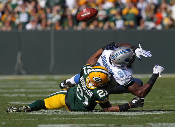 Green Bay Packers cornerback Charles Woodson breaks up a pass