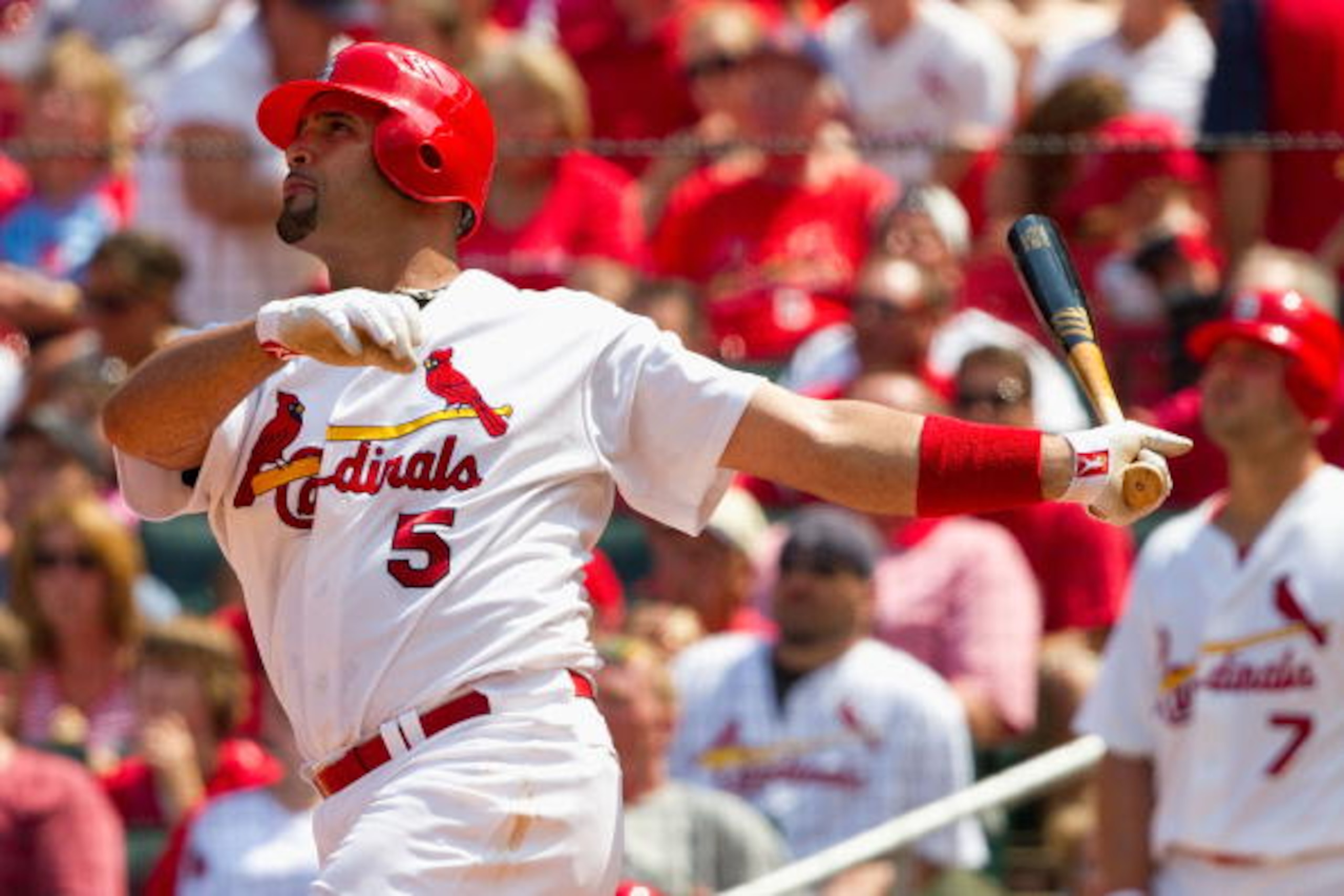 ST. LOUIS - AUGUST 1: Albert Pujols #5 of the St. Louis Cardinals hits a two-run home run against the Pittsburgh Pirates at Busch Stadium on August 1, 2010 in St. Louis, Missouri.  The Cardinals beat the Pirates 9-1.  (Photo by Dilip Vishwanat/Getty Image