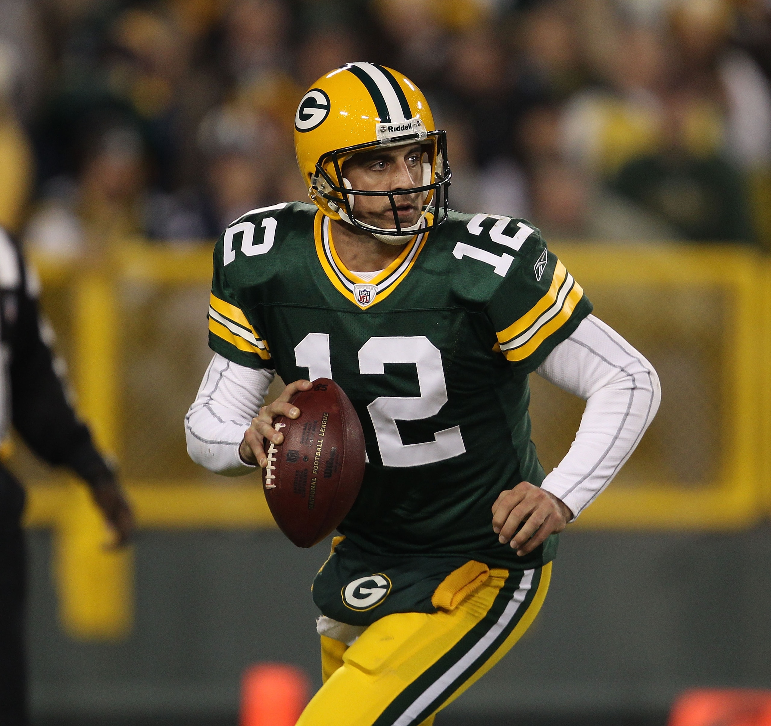 GREEN BAY, WI - NOVEMBER 07: Aaron Rodgers #12 of the Green Bay Packers looks for a receiver against the Dallas Cowboys at Lambeau Field on November 7, 2010 in Green Bay, Wisconsin. The Packers defeated the Cowboys 45-7. (Photo by Jonathan Daniel/Getty Im
