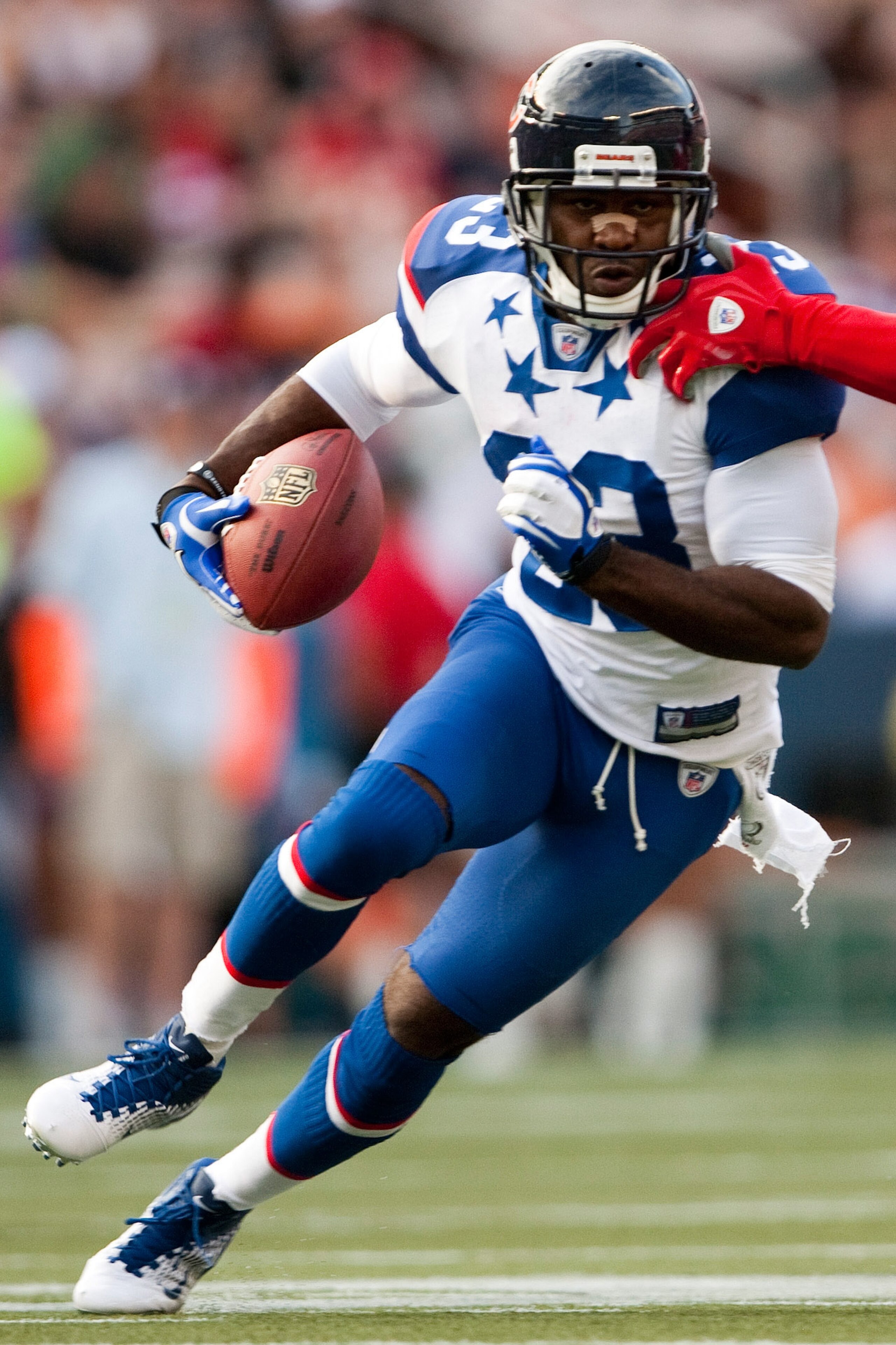 HONOLULU - JANUARY 30:  Devin Hester #23 of the Chicago Bears carries the ball against the American Football Conference (AFC) during the 2011 NFL Pro Bowl at Aloha Stadium on January 30, 2011 in Honolulu, Hawaii.  (Photo by Kent Nishimura/Getty Images)