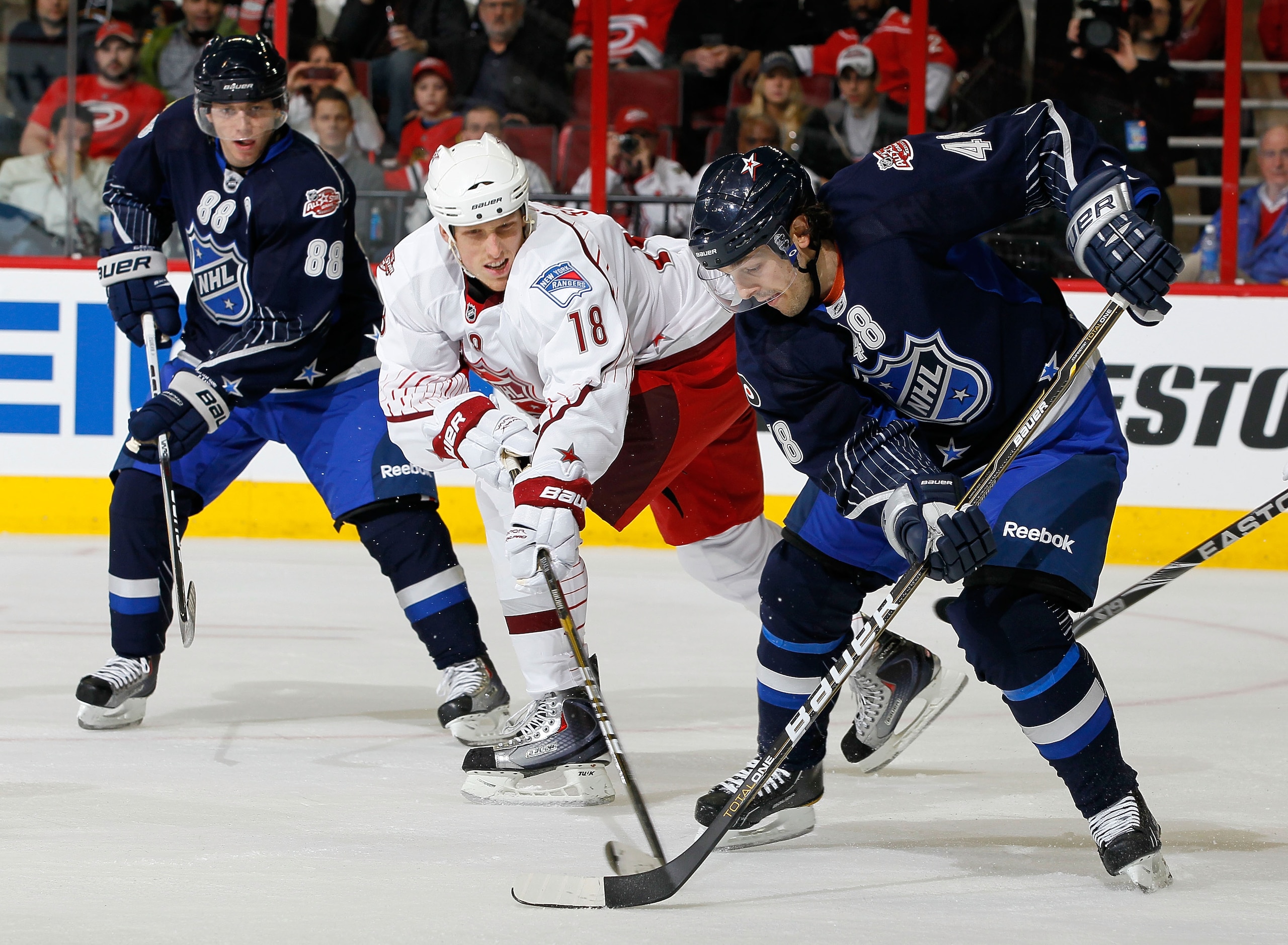 RALEIGH, NC - JANUARY 30:  Team Staal player Marc Staal #18 of the New York Rangers skates against Team Lidstrom player Danny Briere #48 of the Philadelphia Flyers against Team Staal Patrick Kane #88 of the Chicago Blackhawks looks on during the third per
