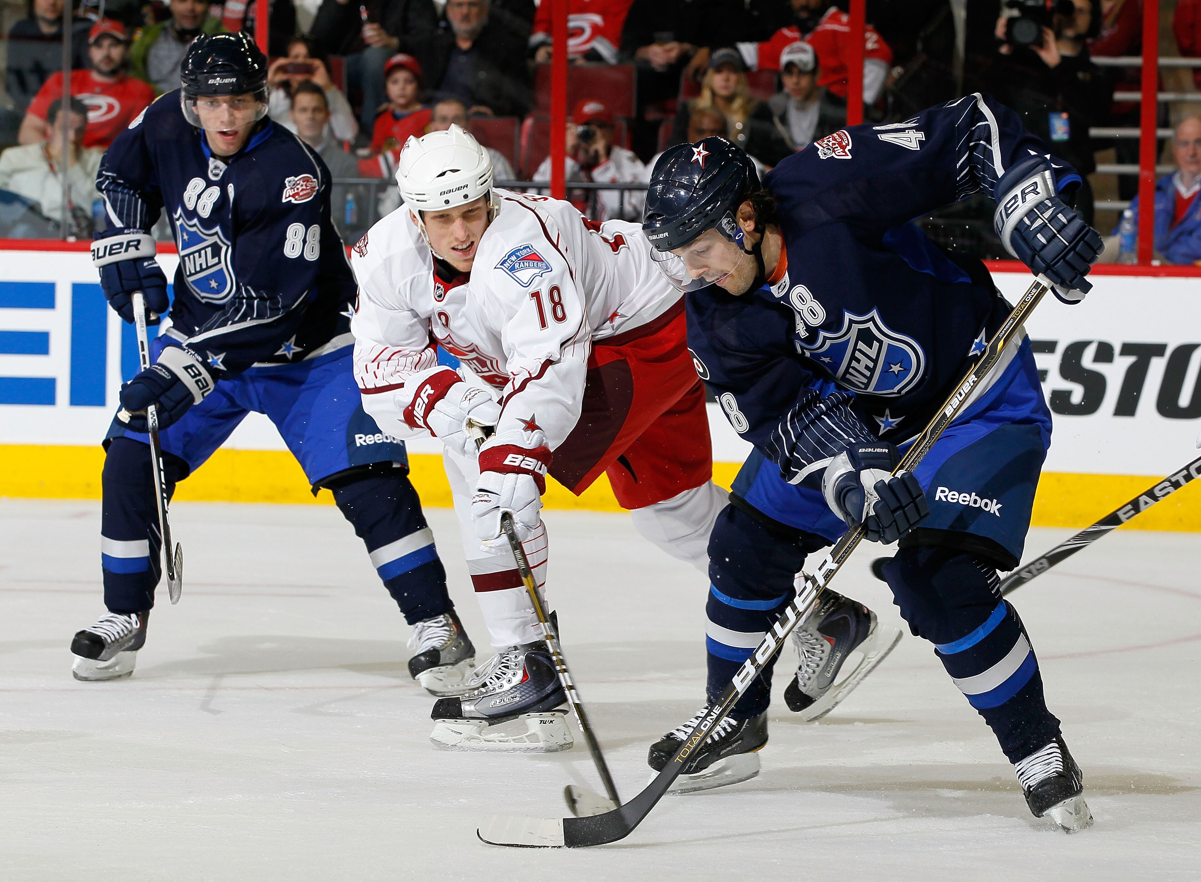 RALEIGH, NC - JANUARY 30:  Team Staal player Marc Staal #18 of the New York Rangers skates against Team Lidstrom player Danny Briere #48 of the Philadelphia Flyers against Team Staal Patrick Kane #88 of the Chicago Blackhawks looks on during the third per