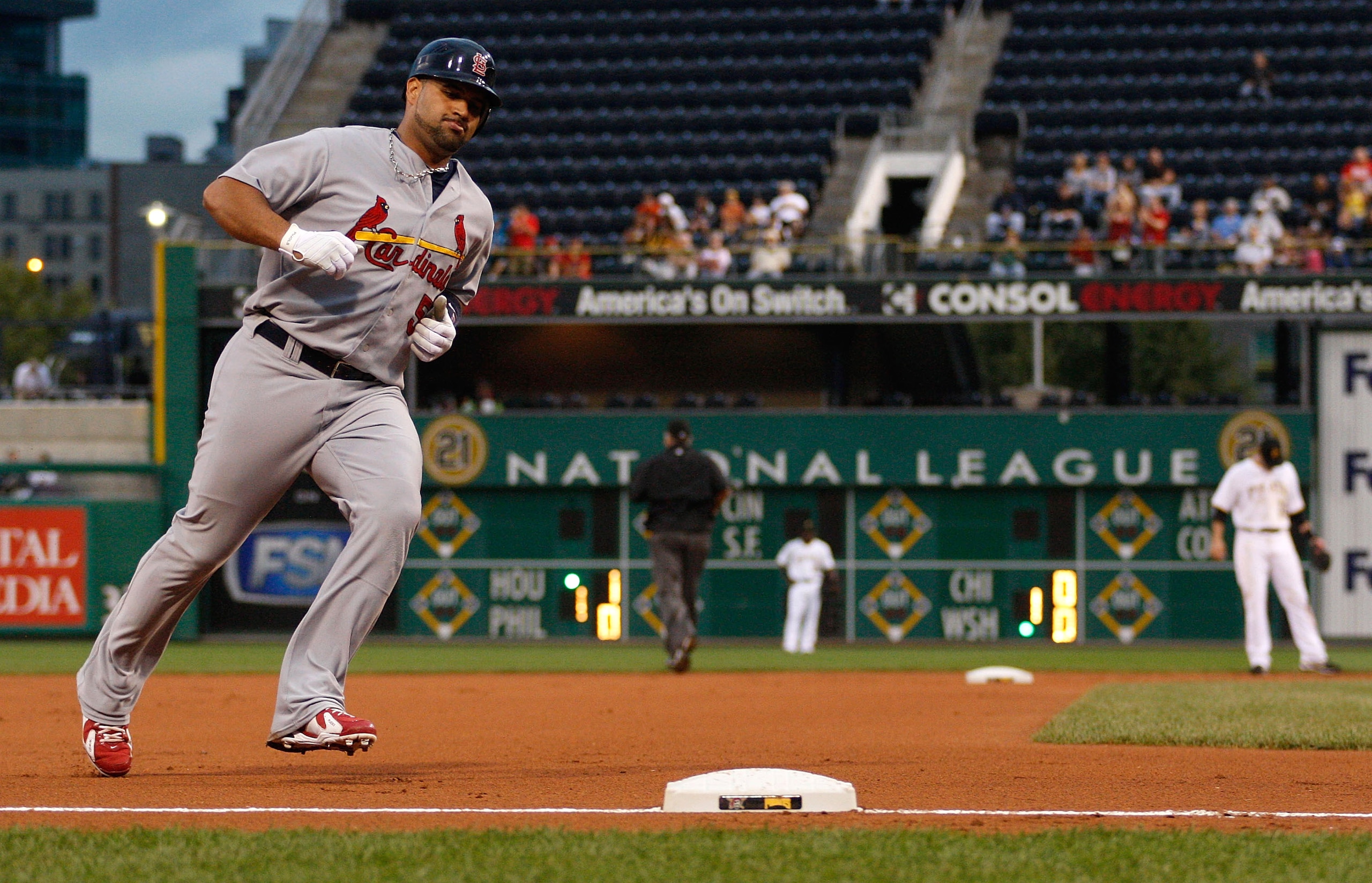 PITTSBURGH - AUGUST 23:  Albert Pujols #5 of the St Louis Cardinals rounds third base after hitting a two run home run against the Pittsburgh Pirates during the game on August 23, 2010 at PNC Park in Pittsburgh, Pennsylvania. His home run was the 399th of