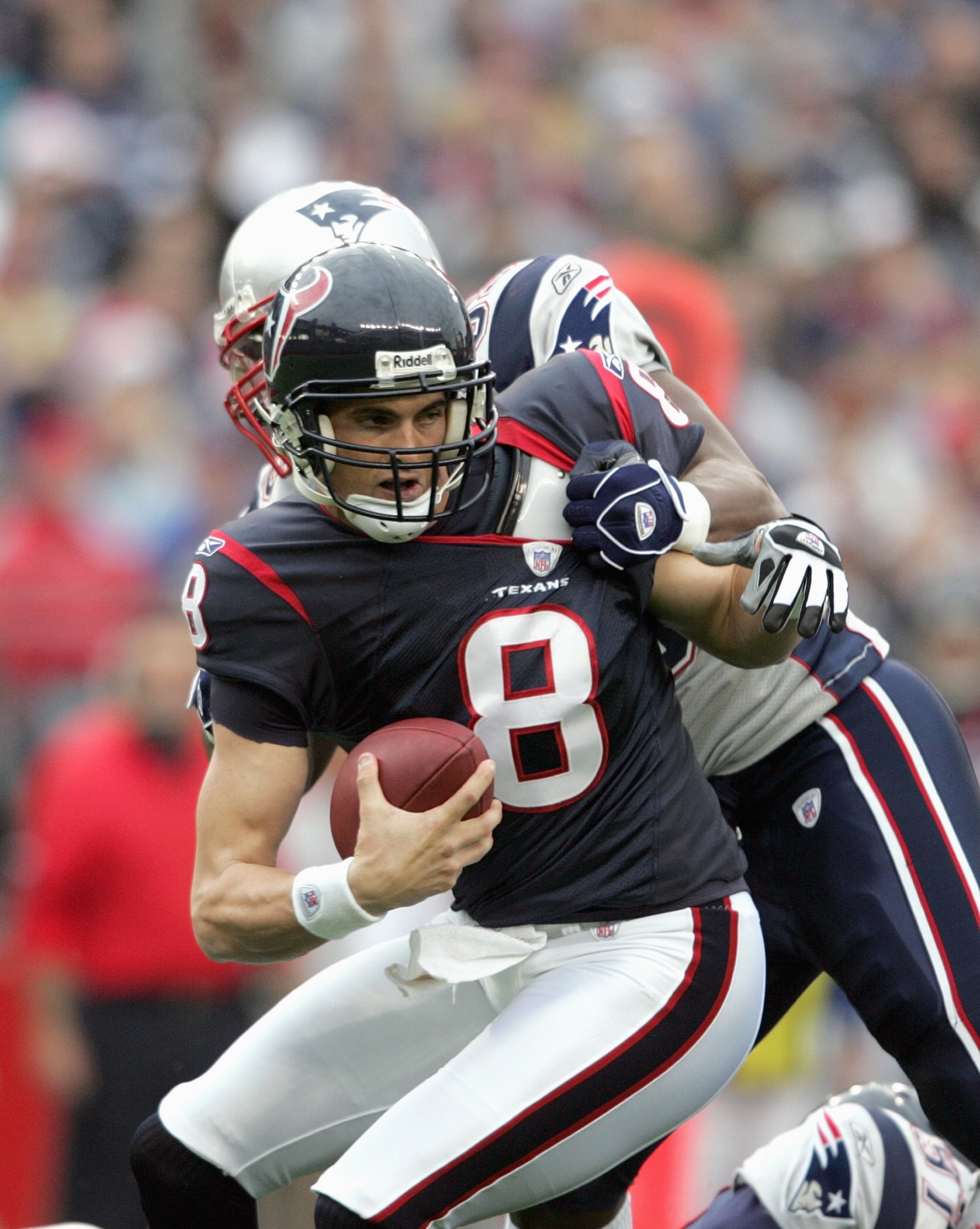 FOXBORO, MA - DECEMBER 17: David Carr #8 of the Houston Texans is sacked by Rosevelt Colvin #59 by the New England Patriots on December 17, 2006 at Gillette Stadium in Foxboro, Massachusetts. The New England Patriots defeated the Houston Texans 40-7. (Pho