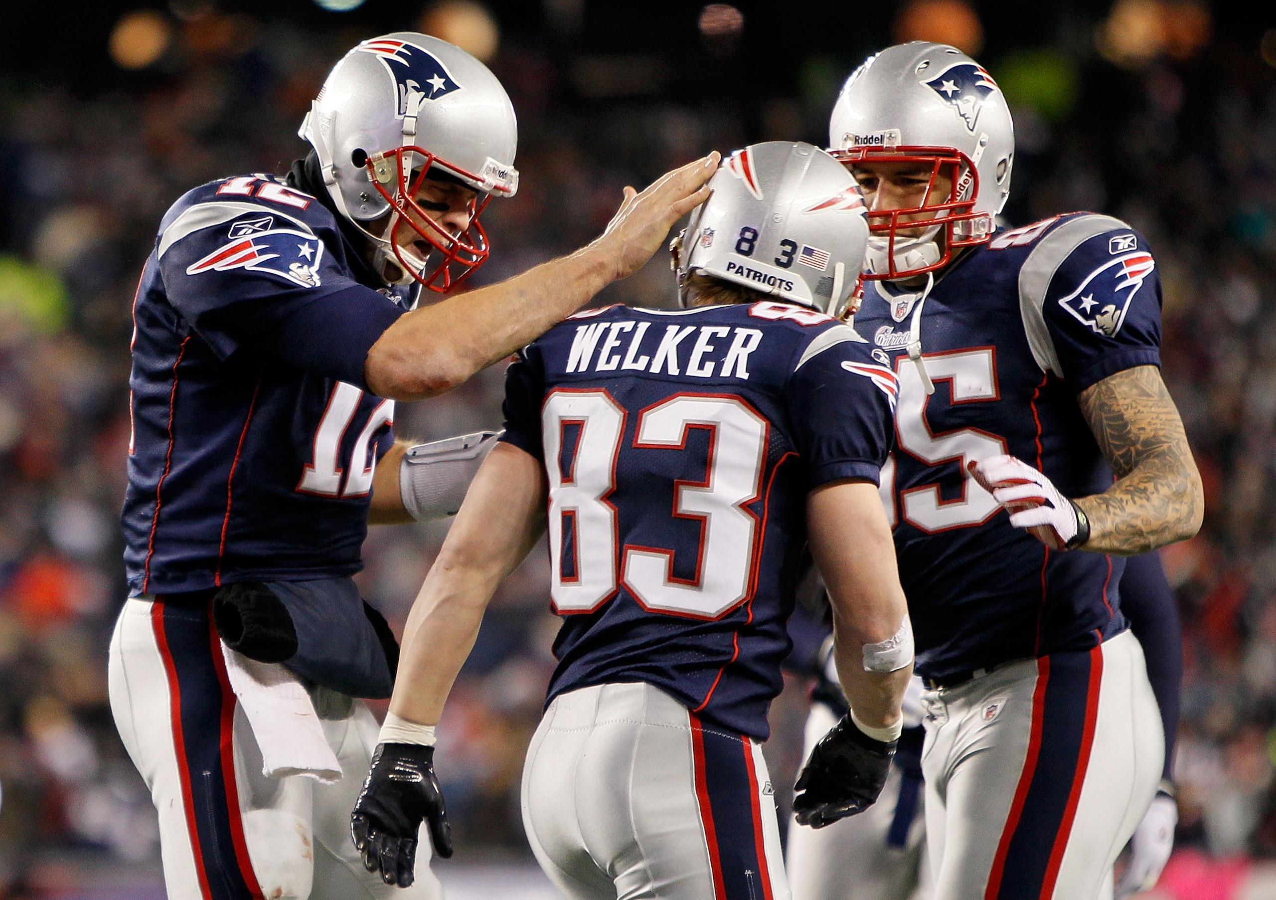 FOXBORO, MA - DECEMBER 06: (L-R) Tom Brady #12, Wes Welker #83 and Aaron Hernandez #85 of the New England Patriots celebrate after Welker scored a touchdown in the third quarter against the New York Jets at Gillette Stadium on December 6, 2010 in Foxboro FOXBORO, MA - DECEMBER 06: (L-R) Tom Brady #12, Wes Welker #83 and Aaron Hernandez #85 of the New England Patriots celebrate after Welker scored a touchdown in the third quarter against the New York Jets at Gillette Stadium on December 6, 2010 in Foxboro