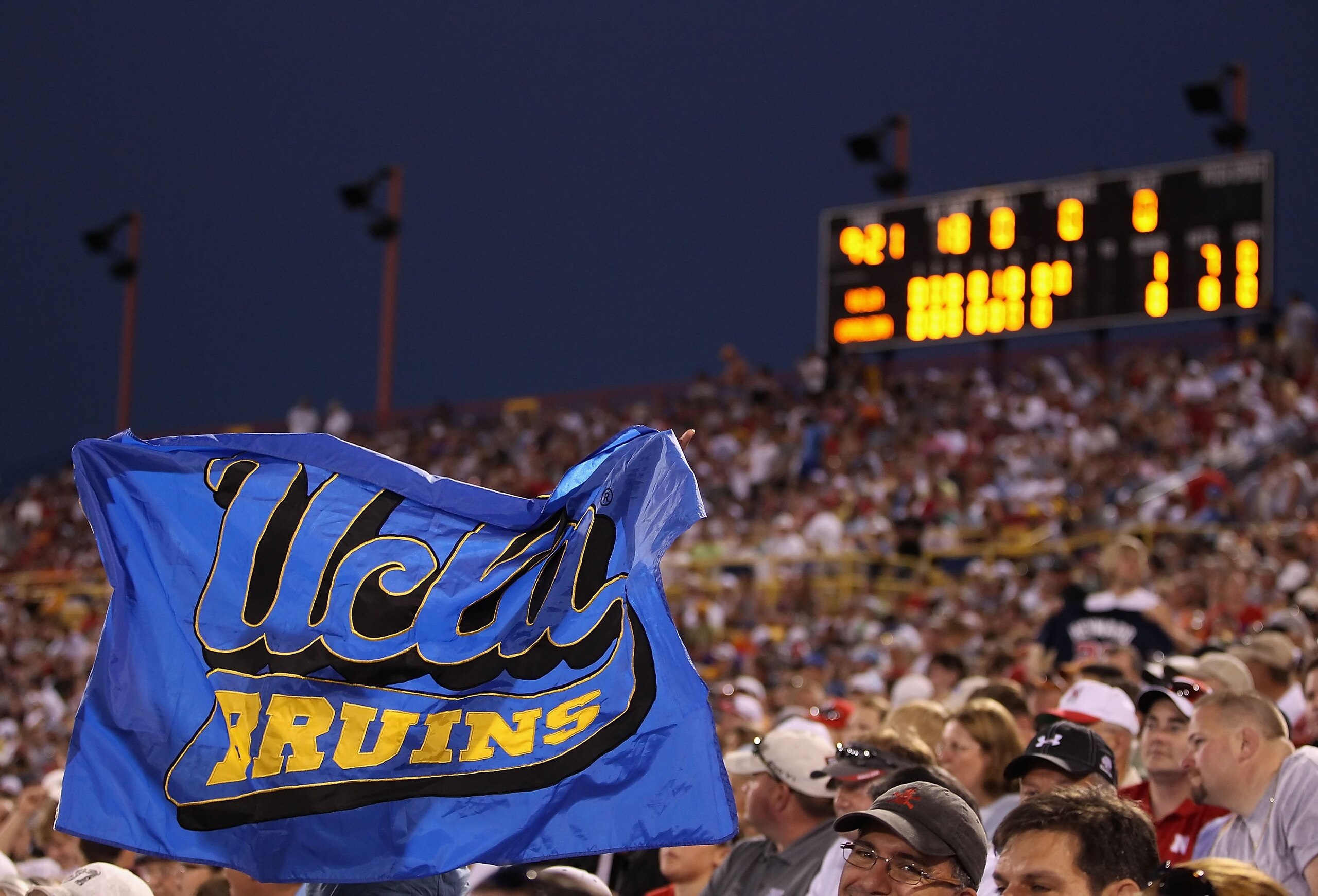 OMAHA, NE - JUNE 29:  Fans of the UCLA Bruins hold up a flag during game 2 of the men's 2010 NCAA College Baseball World Series against the South Carolina Gamecocks at Rosenblatt Stadium on June 29, 2010 in Omaha, Nebraska.  The Gamecocks defeated the Bru