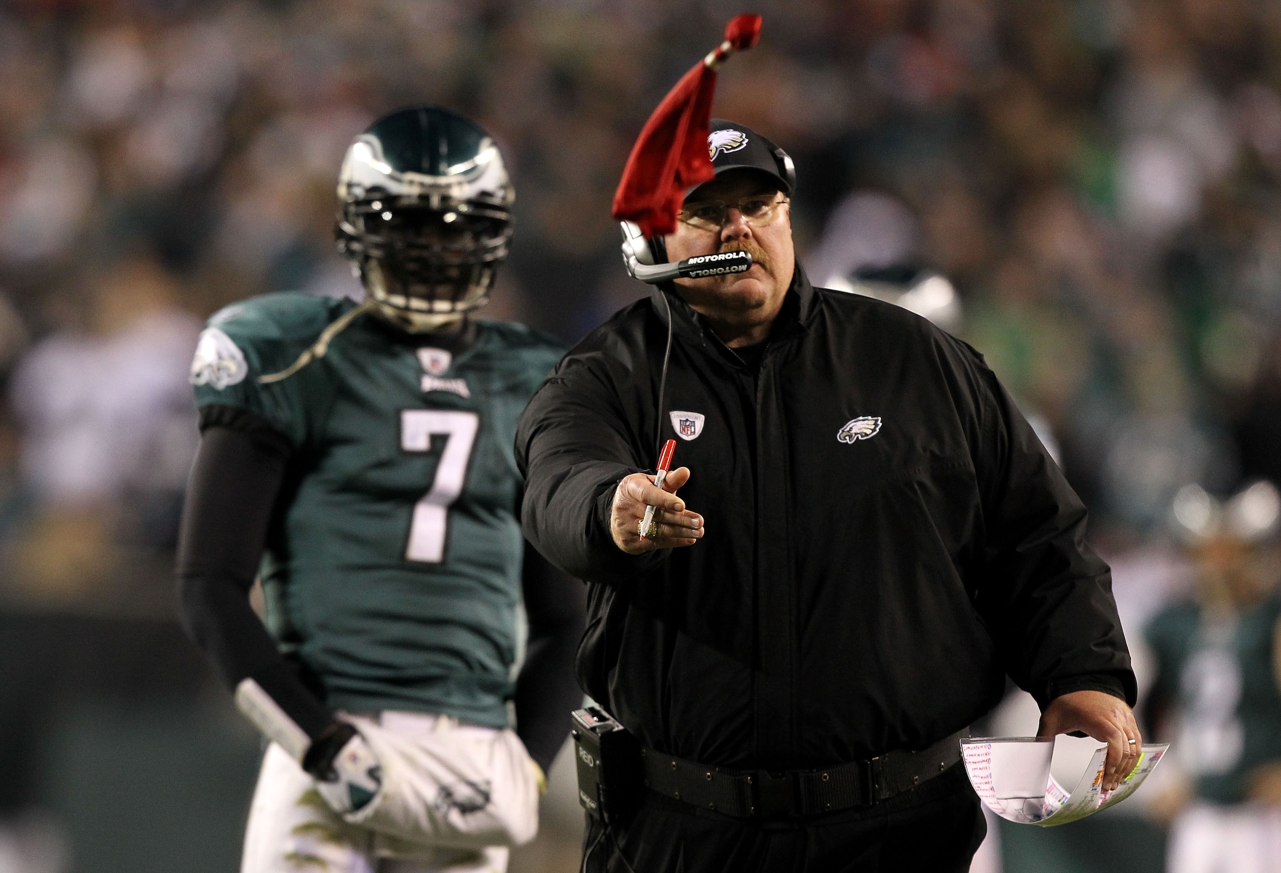 PHILADELPHIA, PA - DECEMBER 02:  Head coach Andy Reid of the Philadelphia Eagles throws the red challenge flag on a play involving Brent Celek #87 in the second half as Michael Vick #7 looks on against the Houston Texans at Lincoln Financial Field on Dece