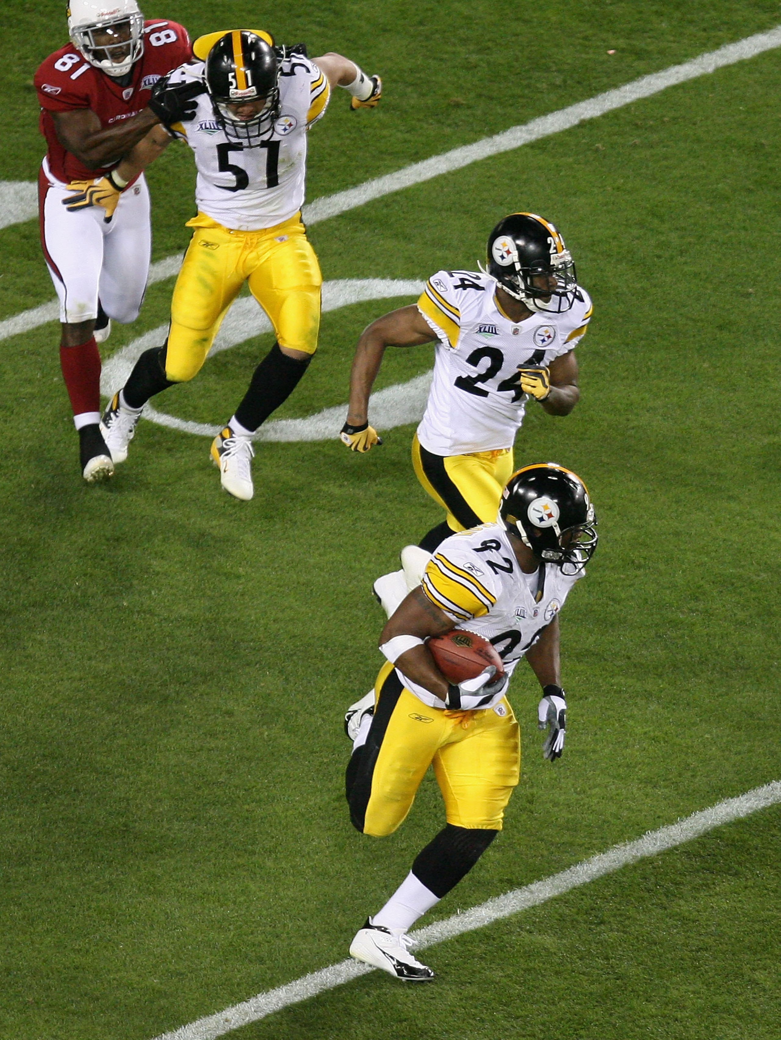 TAMPA, FL - FEBRUARY 01:  James Harrison #92 of the Pittsburgh Steelers runs back an interception for 100 for a touchdown in the second quarter against the Arizona Cardinals during Super Bowl XLIII on February 1, 2009 at Raymond James Stadium in Tampa, Fl