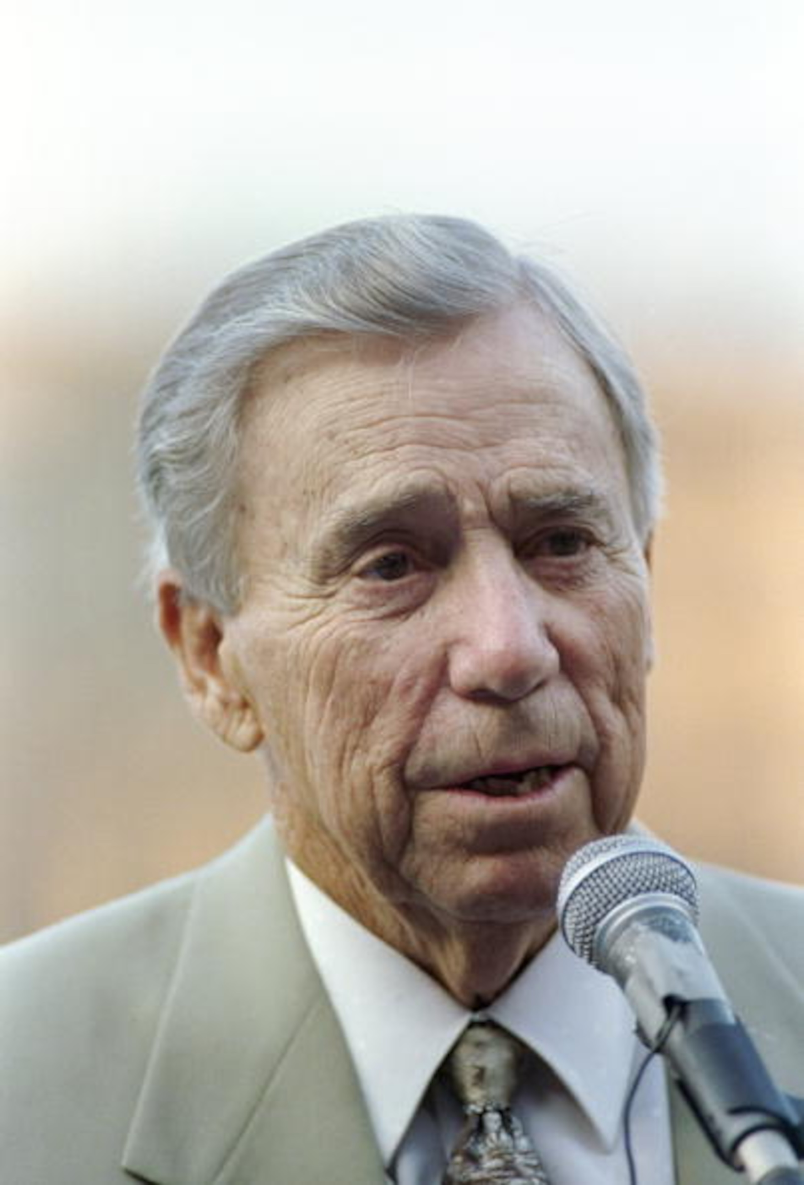 15 Aug 1997: Former shortstop Pee-Wee Reese speaks during a ceremony to retire former Los Angeles Dodgers'' manager Tommy Lasorda's uniform number at Dodger Stadium in Los Angeles, California.