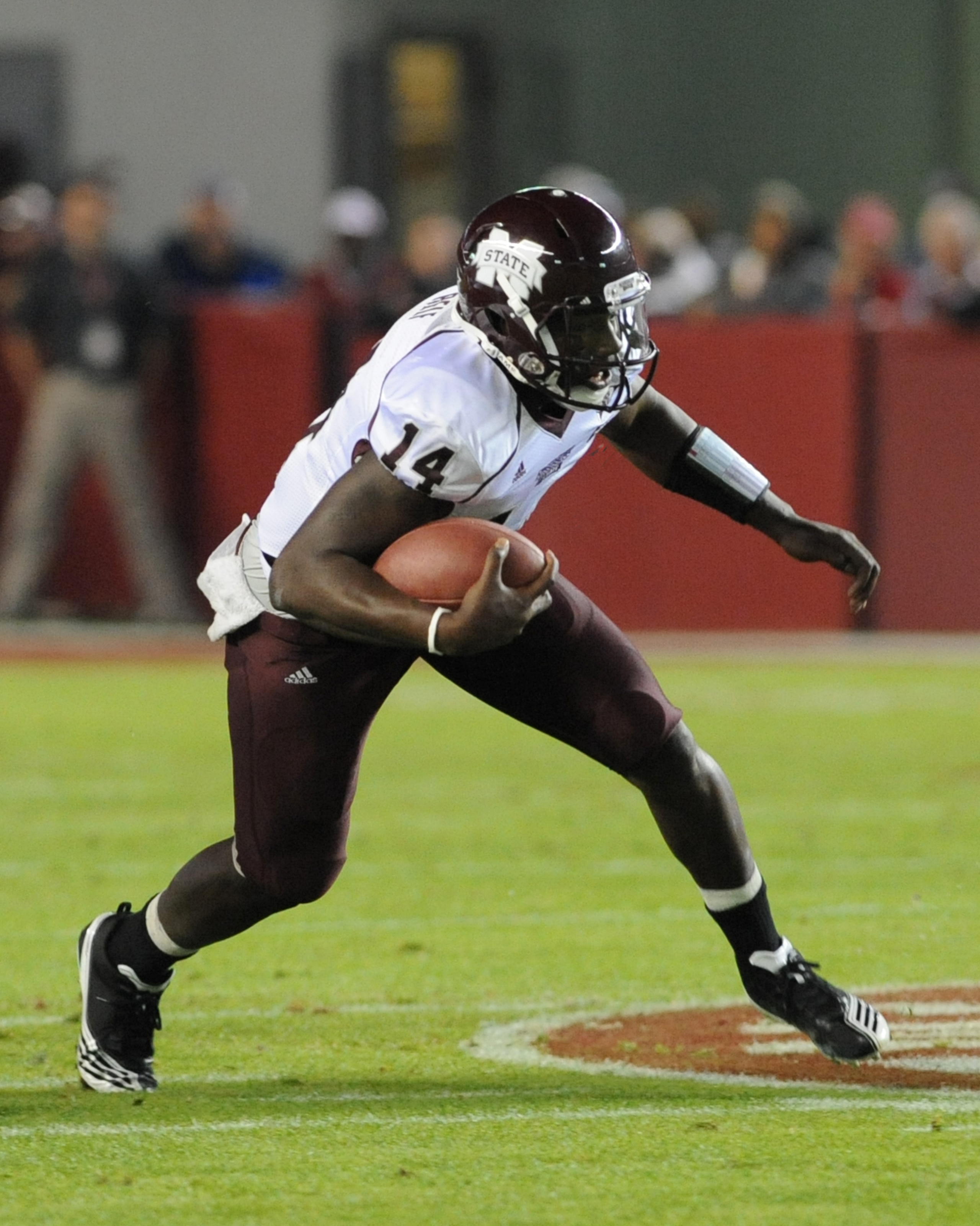 TUSCALOOSA, AL - NOVEMBER 13: Quarterback Chris Reif #14 of the Mississippi State Bulldogs rushes upfield against the Alabama Crimson Tide November 13, 2010 at Bryant-Denny Stadium in Tuscaloosa, Alabama.  (Photo by Al Messerschmidt/Getty Images)