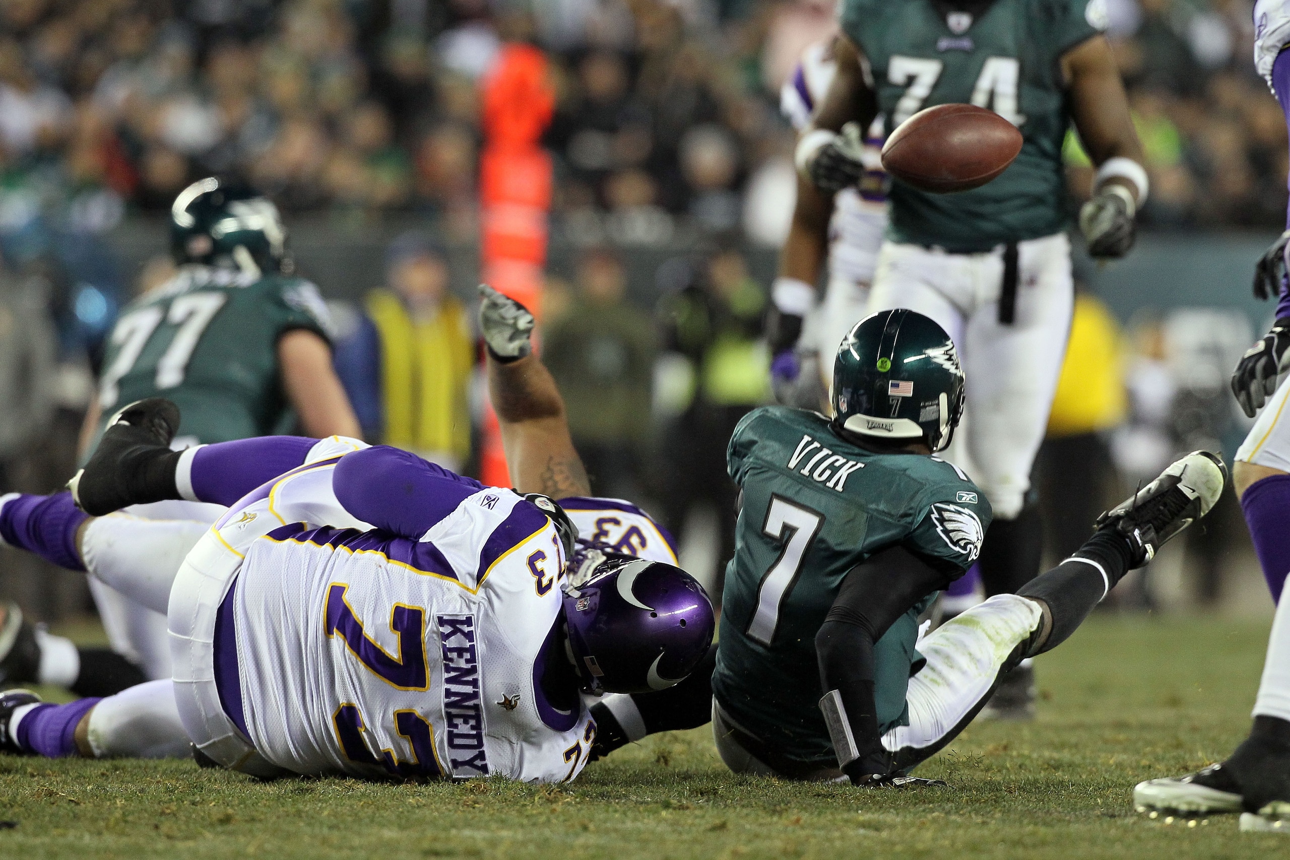PHILADELPHIA, PA - DECEMBER 28:  Michael Vick #7 of the Philadelphia Eagles fumbles against Jimmy Kennedy #73 of the Minnesota Vikings at Lincoln Financial Field on December 26, 2010 in Philadelphia, Pennsylvania.  (Photo by Jim McIsaac/Getty Images)
