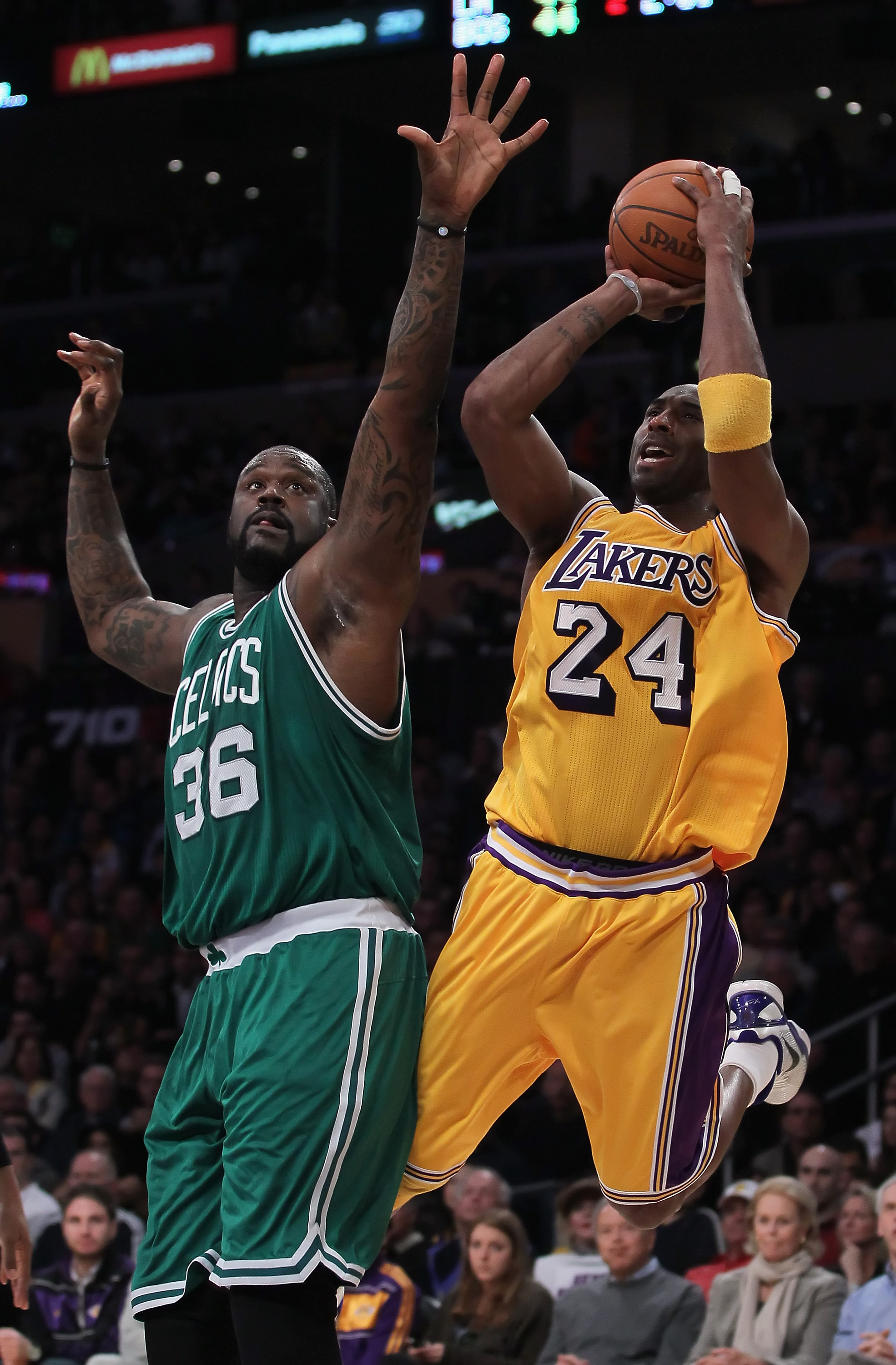 LOS ANGELES, CA - JANUARY 30:  Kobe Bryant #24 of the Los Angeles Lakers is fouled while shooting by Shaquille O'Neal #36 of the Boston Celtics in the first half at Staples Center on January 30, 2011 in Los Angeles, California.  (Photo by Jeff Gross/Getty