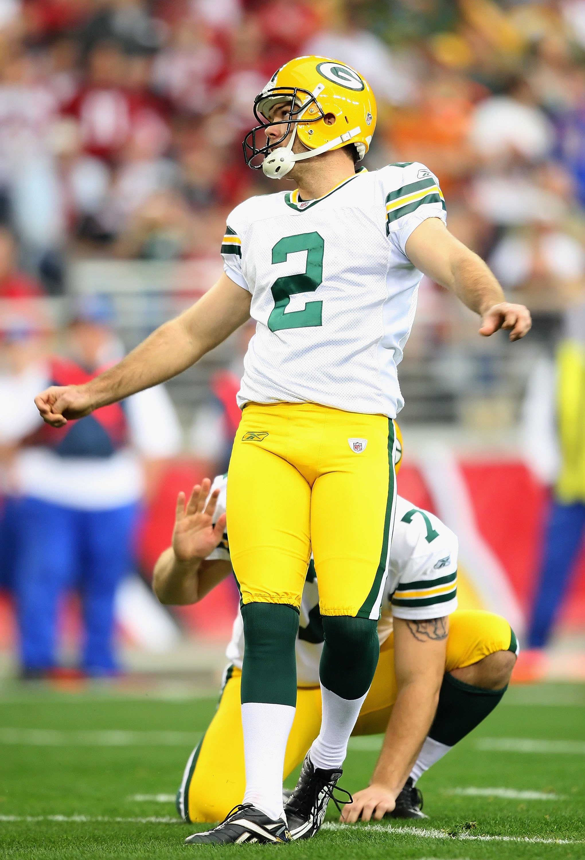 Two Green Bay Packers fans wear different style cheese head hats during the  first half of the Packers-Arizona Cardinals game at University of Phoenix  Stadium in Glendale, Arizona, December 27, 2015. Photo