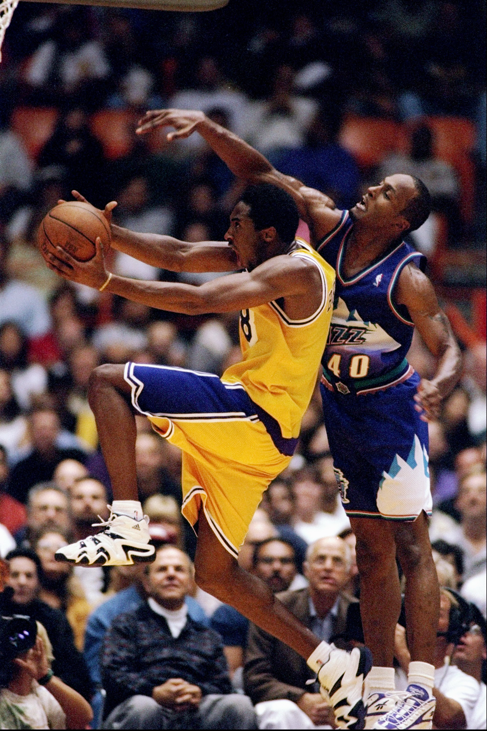 31 Oct 1997:  Guard Kobe Bryant of the Los Angeles Lakers (left) in action against forward Shandon Anderson of the Utah Jazz during a game at the Great Western Forum in Inglewood, California.  The Lakers won the game 104-87. Mandatory Credit: Elsa Hasch