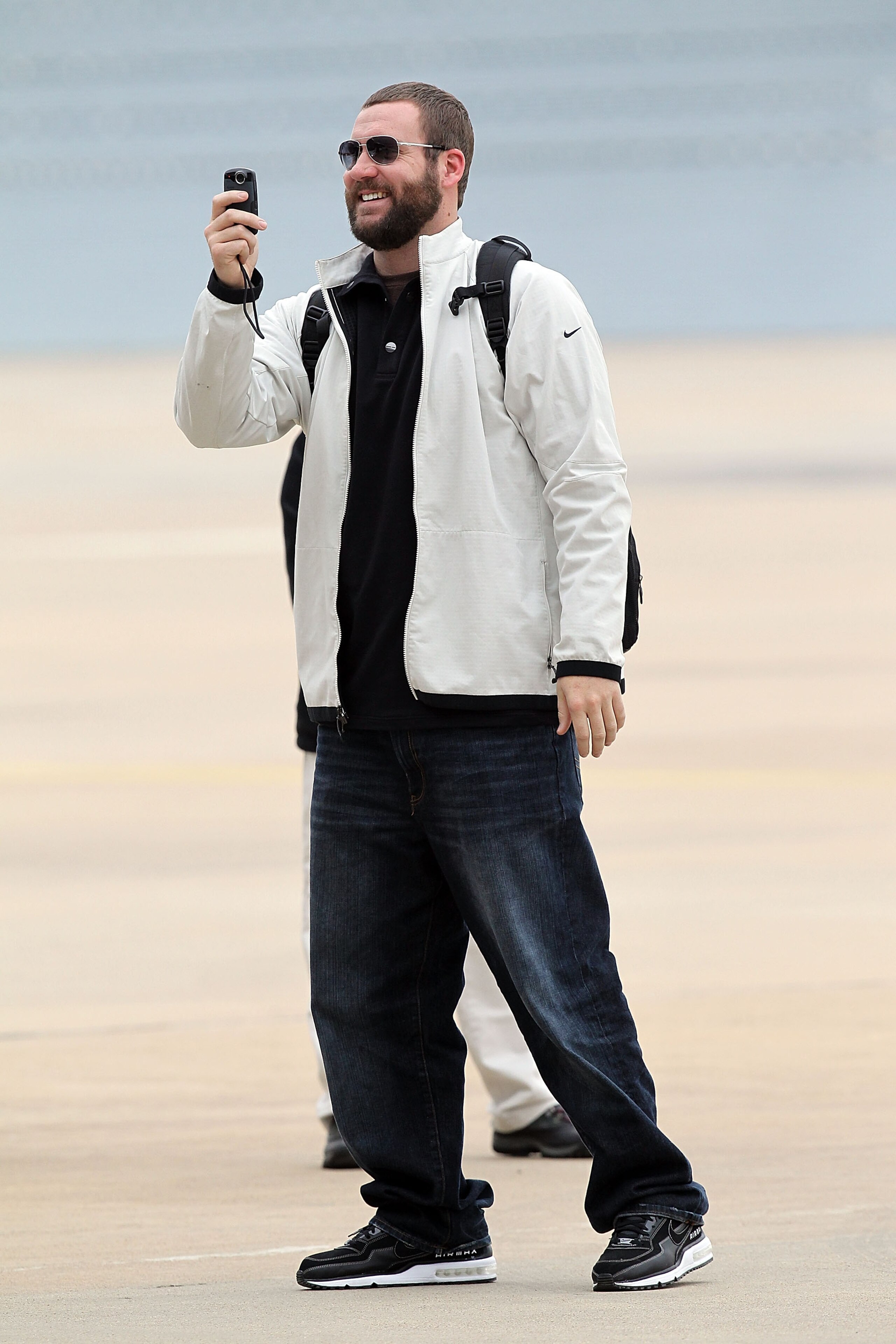 DALLAS, TX - JANUARY 31:  Quarterback Ben Roethlisberger #7 of the Pittsburgh Steelers records a video while arriving at Dallas Fort Worth International Airport on January 31, 2011 in Dallas, Texas.  The Pittsburgh Steelers will play the Green Bay Packers