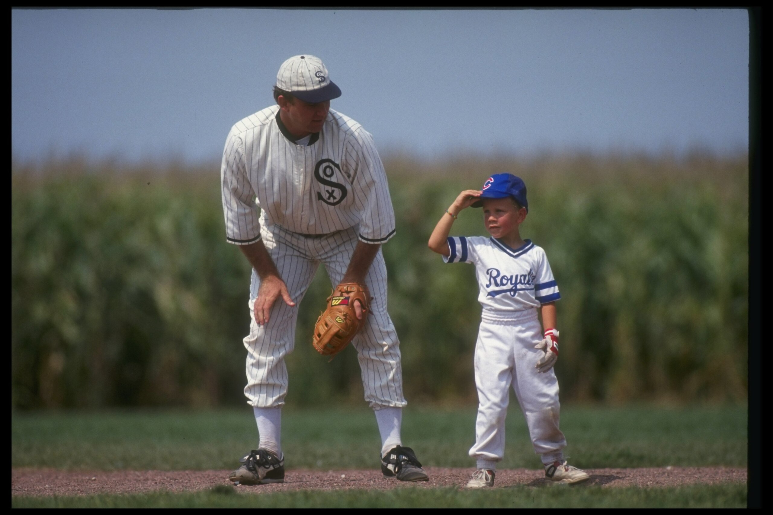 DYERSVILLE, IA - AUGUST 25: A 'ghost player' recreating the role of Chicago White Sox legend Shoeless Joe Jackson plays ball with a young tourist at the baseball field created for the motion picture 'Field of Dreams' on August 25, 1991 in Dyersville, Iowa DYERSVILLE, IA - AUGUST 25: A 'ghost player' recreating the role of Chicago White Sox legend Shoeless Joe Jackson plays ball with a young tourist at the baseball field created for the motion picture 'Field of Dreams' on August 25, 1991 in Dyersville, Iowa
