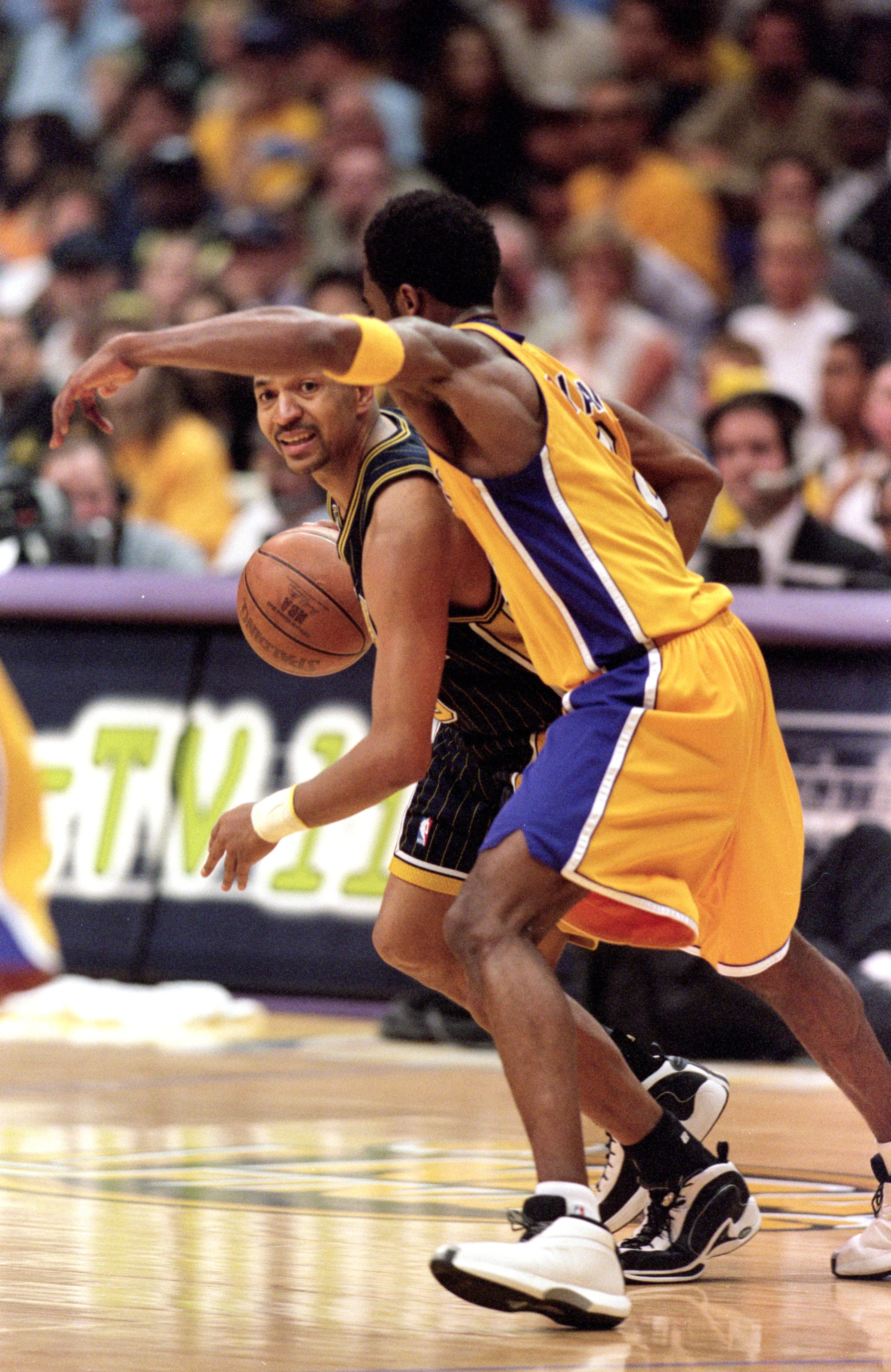 19 Jun 2000: Mark Jackson #13 of the Indiana Pacers dribbles the ball down the court as he is guarded by Kobe Bryant #8 of the Los Angeles Lakers  during the NBA Finals Game 6 at the Staples Center in Los Angeles, California.  The Lakers defeated the Pace