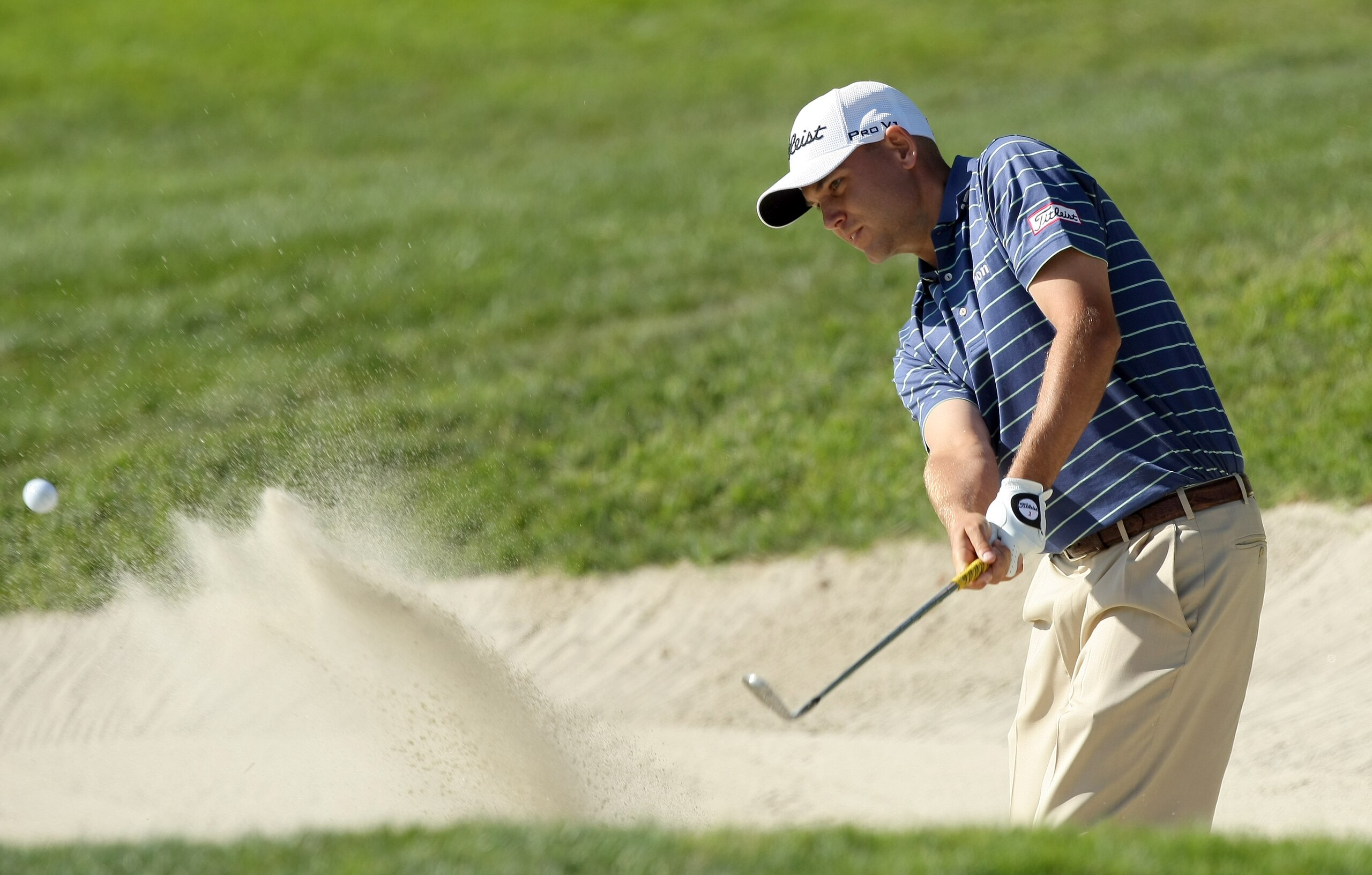 LA JOLLA, CA - JANUARY 29:  Bill Haas hits out of the 6th green bunker during Round 3 of the Farmers Insurance Open at Torrey Pines on January 29, 2011 in La Jolla, California. (Photo by Donald Miralle/Getty Images)