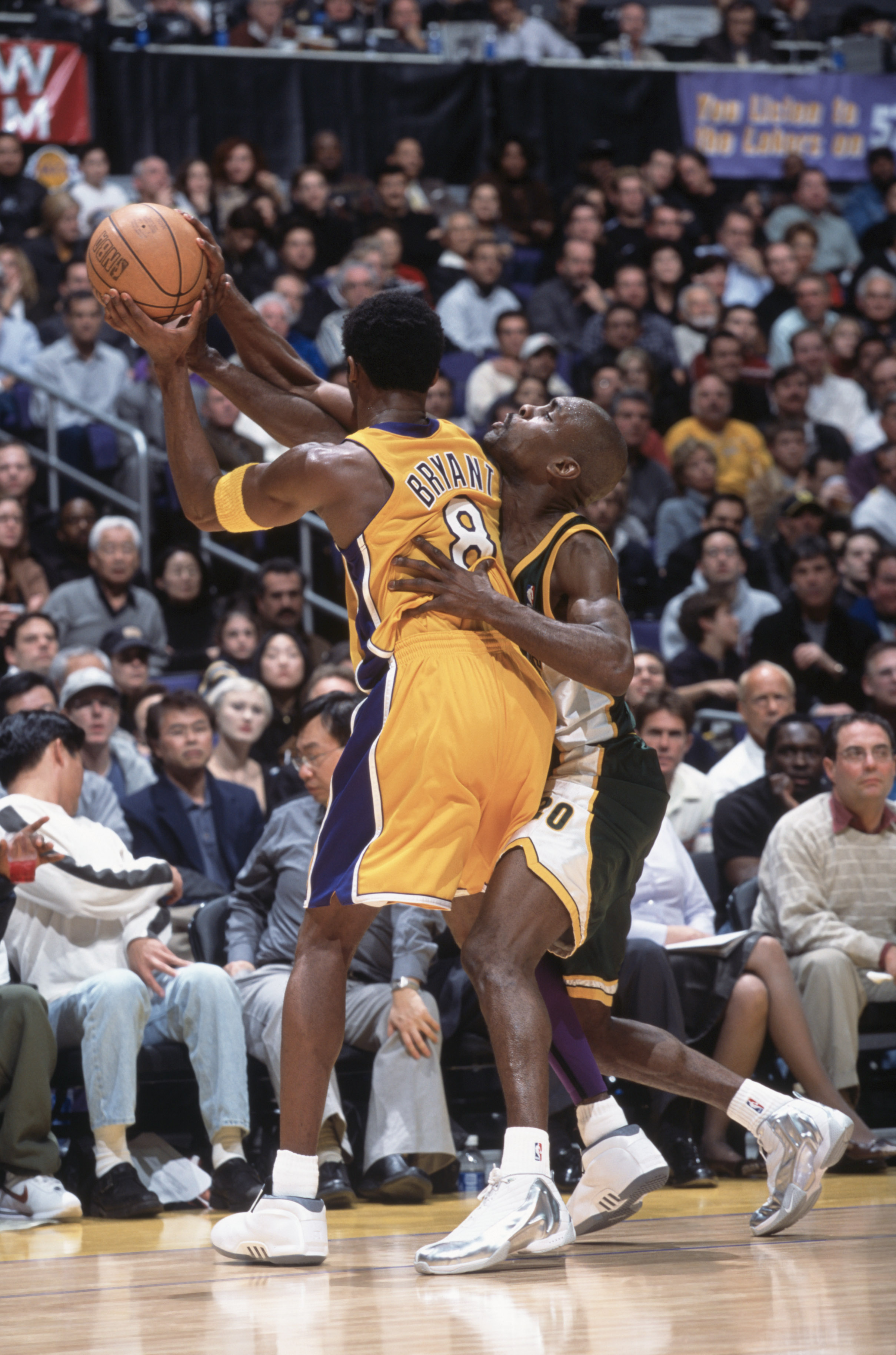 11 Dec 2001:  Point guard Gary Payton #20 of the Seattle SuperSonics guards Kobe Bryant #8 of the Los Angeles Lakers during the NBA game at the Staples Center in Los Angeles, California.  The SuperSonics defeated the Lakers 104-93.Mandatory Credit: Jeff G
