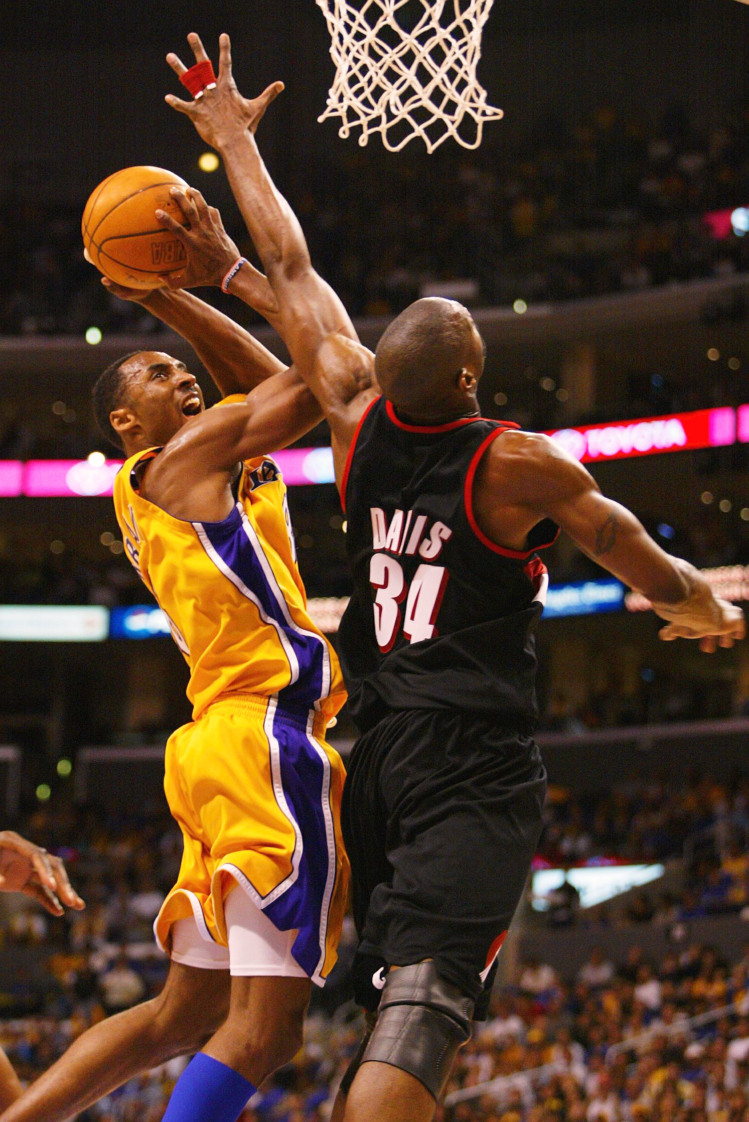 21 Apr 2002:  Dale Davis #34 of the Portland Trail Blazers attempts to block Kobe Bryant #8 of the Los Angeles Lakers during round one of the 2002 NBA Playoffs at Staples Center in Los Angeles, California.  DIGITAL IMAGE NOTE TO USER:  User expressly ackn
