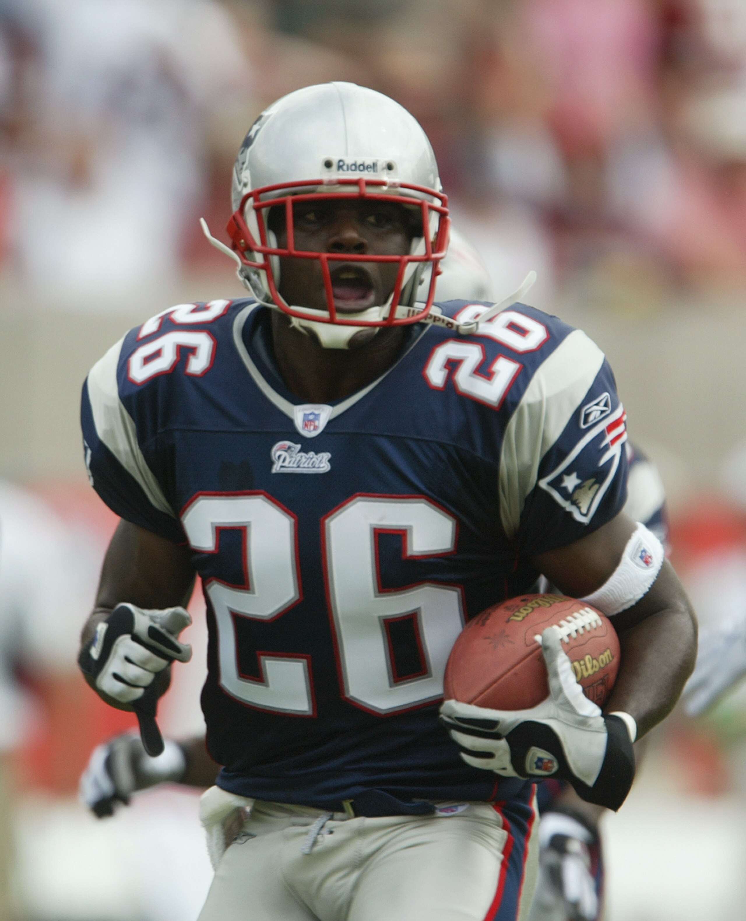TEMPE, AZ - SEPTEMBER 19:  Corner back Eugene Wilson #26 of the New England Patriots carries the ball during the game against the Arizona Cardinals at Sun Devil Stadium on September 19, 2004 in Tempe, Arizona. The Patriots won 23-12. (Photo by Jeff Gross/