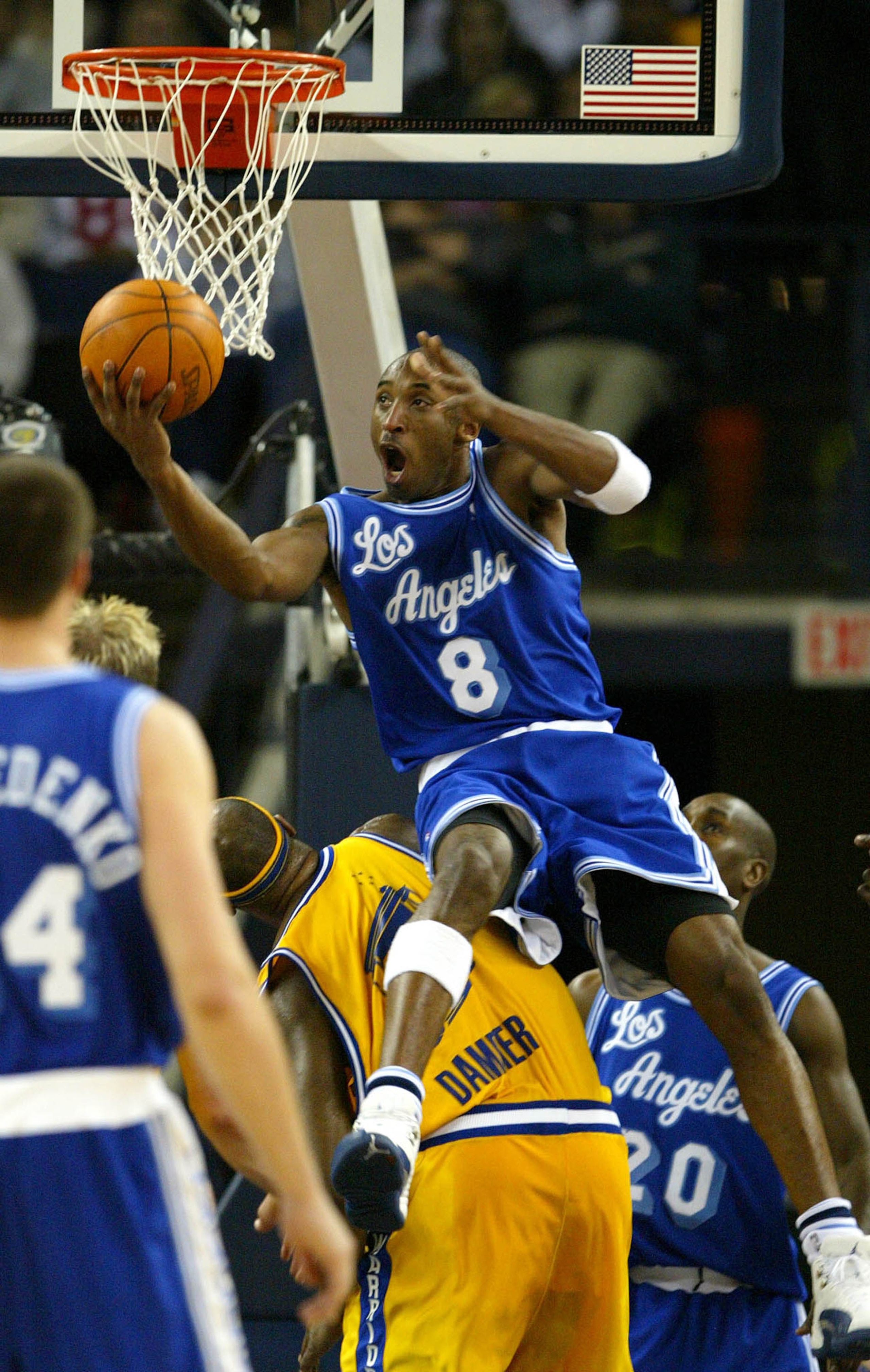 OAKLAND, CA -  DECEMBER 23:  Kobe Bryant #8 of the Los Angeles Lakers shoots over Erick Dampier #25 of the Golden State Warriors during an NBA game at the the Arena in Oakalnd on December 23, 2003 in Oakland, California.  NOTE TO USER: User expressly ackn
