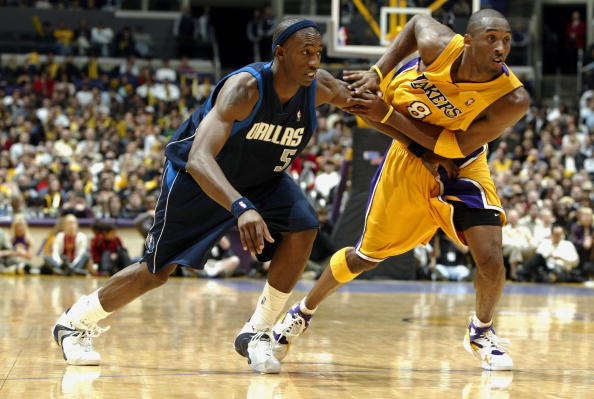 LOS ANGELES - DECEMBER 12:  Kobe Bryant #8 of the Los Angeles Lakers pushes off on Josh Howard #5 of the Dallas Mavericks during the game at Staples Center on December 12, 2003 in Los Angeles, California.  The Mavericks won 110-93.  NOTE TO USER: User exp