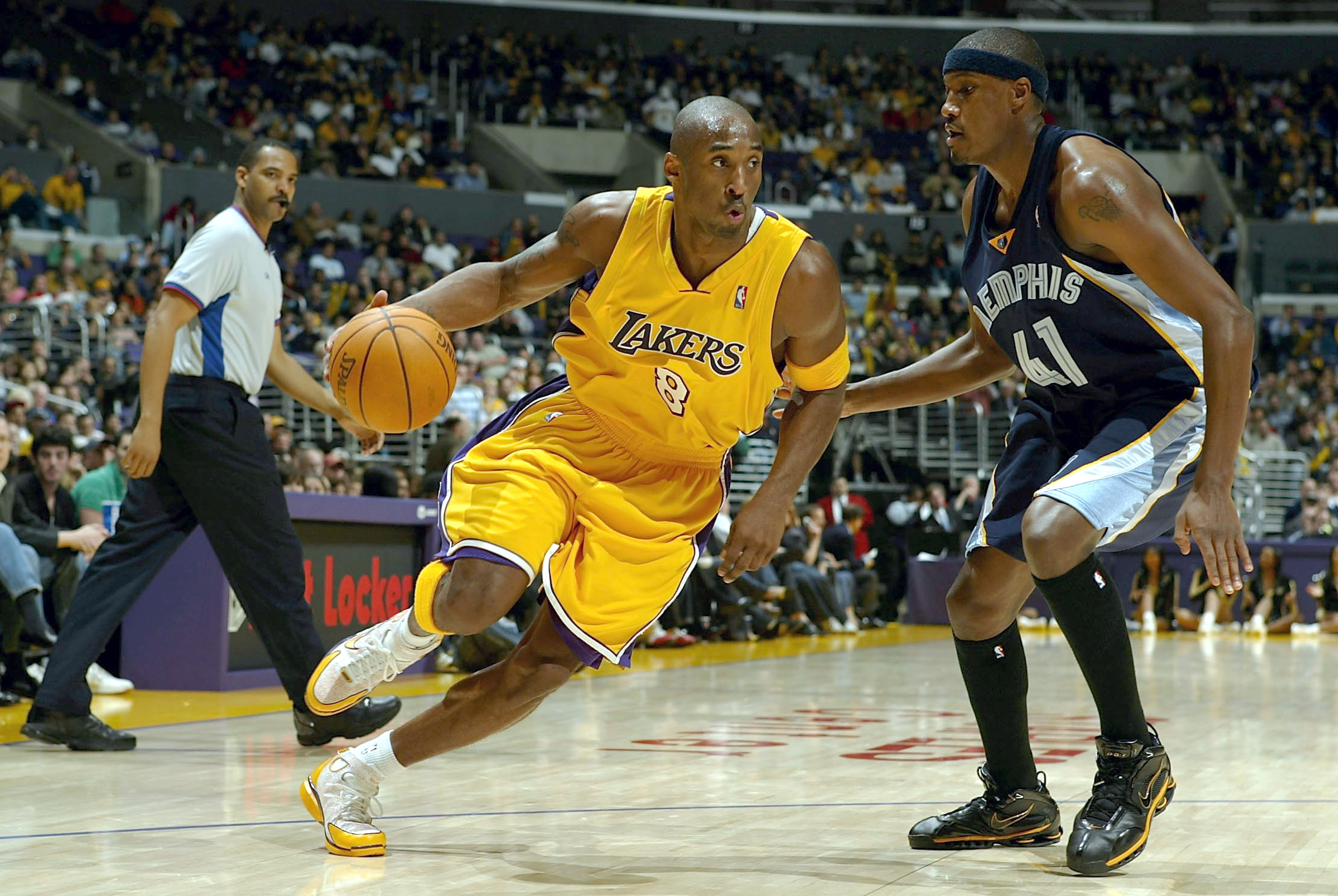 LOS ANGELES - DECEMBER 20:  Kobe Bryant #8 of the Los Angeles Lakers drives on James Posey #41 of the Memphis Grizzlies in the second half at Staples Center on December 20, 2004 in Los Angeles, California.   NOTE TO USER: User expressly acknowledges and a