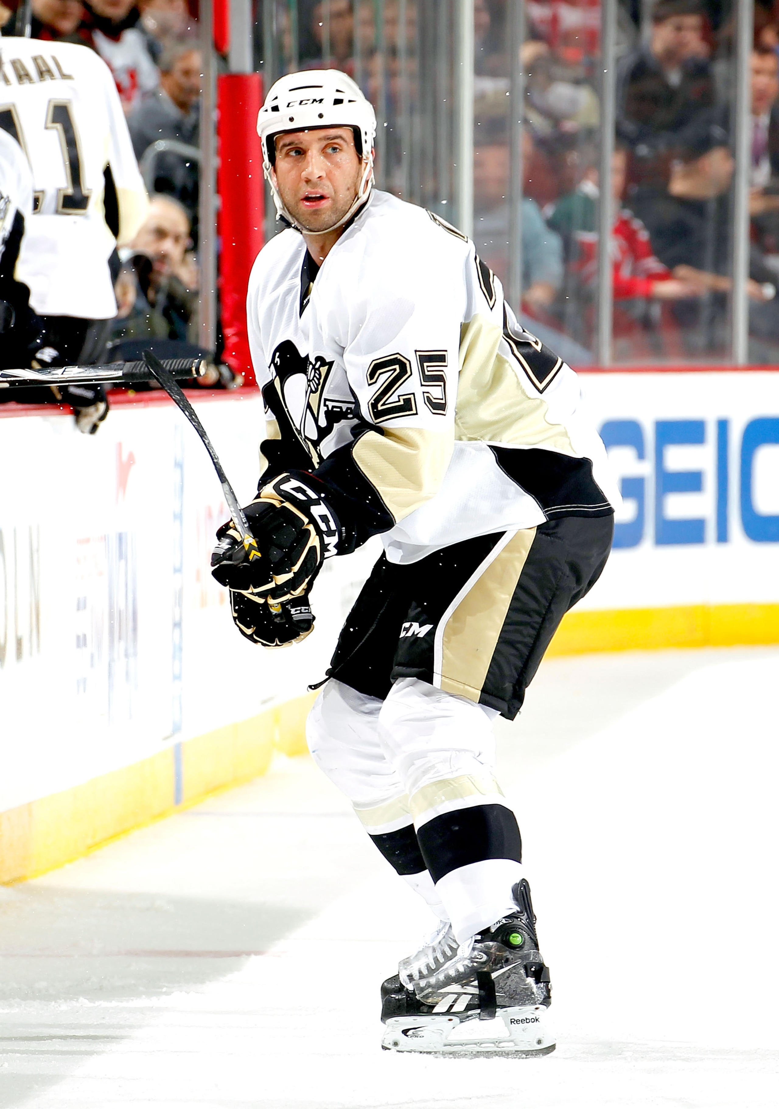 NEWARK, NJ - JANUARY 20:  Maxime Talbot #25 of the Pittsburgh Penguins clears the puck during an NHL hockey game against the New Jersey Devils at the Prudential Center on January 20, 2011 in Newark, New Jersey.  (Photo by Paul Bereswill/Getty Images)
