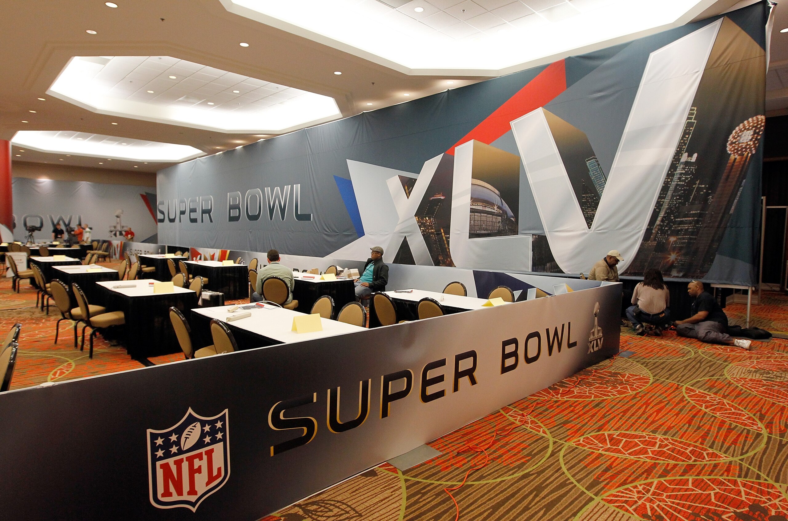 DALLAS, TX - JANUARY 30:  Members of the working media arrive for the opening day of the Motorola Super Bowl XLV Media Center on January 30, 2011 in Dallas, Texas.  Cowboys Stadium will host Super Bowl XLV on February 6, 2011 between the Pittsburgh Steele
