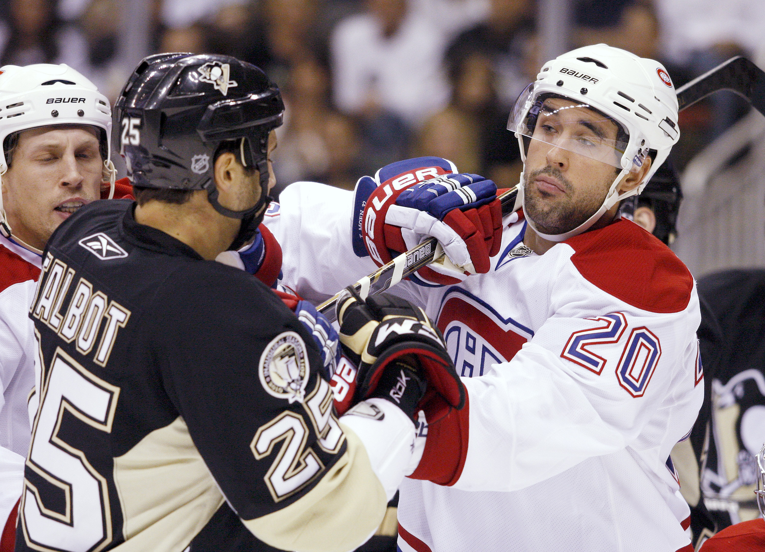 PITTSBURGH - OCTOBER 9:  Max Talbot #25 of the Pittsburgh Penguins and Ryan O'Byrne #20 of the Montreal Canadiens mix it up in the first period at Consol Energy Center on October 9, 2010 in Pittsburgh, Pennsylvania.  (Photo by Justin K. Aller/Getty Images