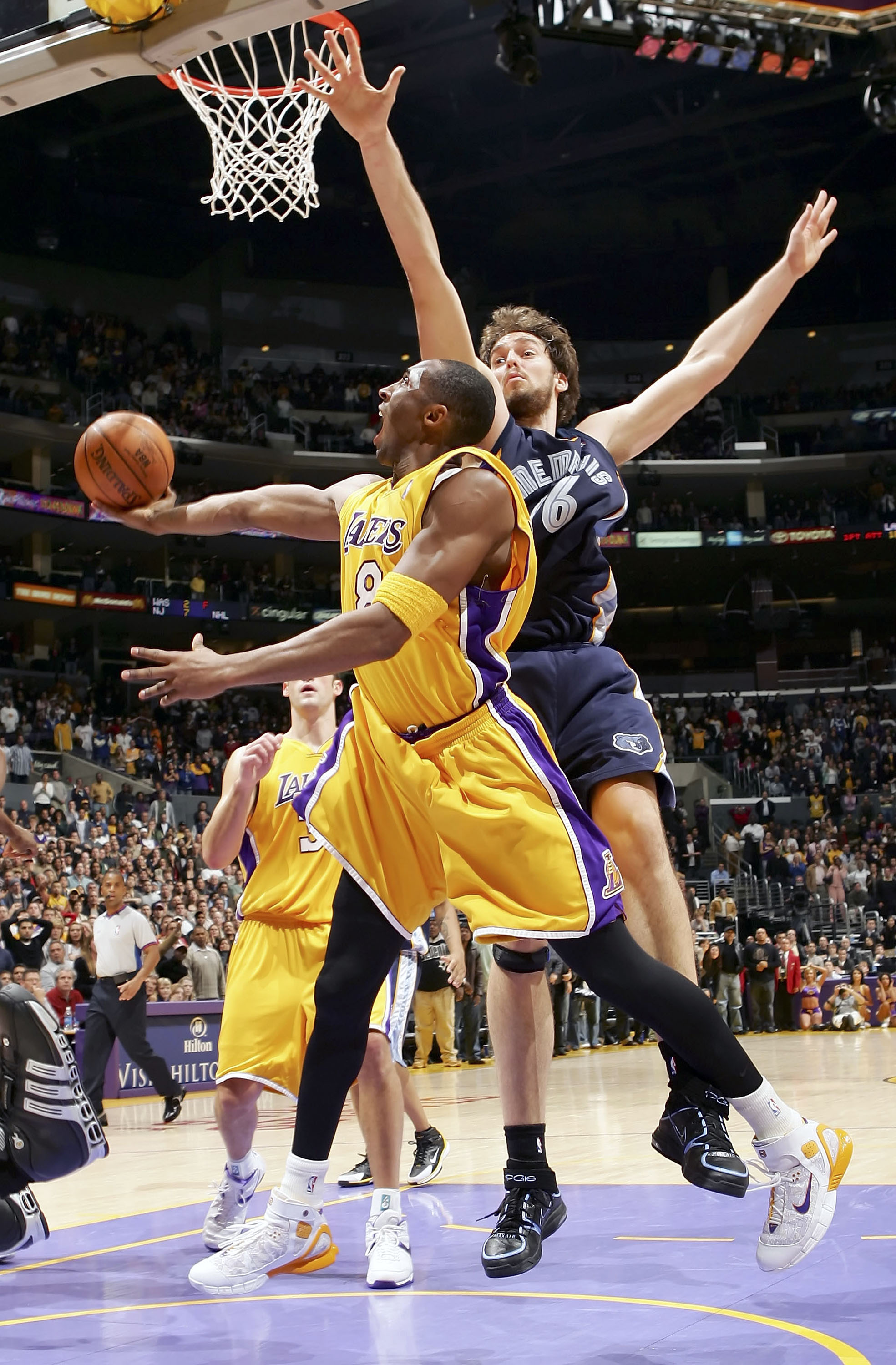 LOS ANGELES - DECEMBER 28:   Kobe Bryant #8 of the Los Angeles Lakers puts a shot up against Pau Gasol #16 of the Memphis Grizzlies during the final seconds of overtime on December 28, 2005 at Staples Center in Los Angeles, California. NOTE TO USER: User 