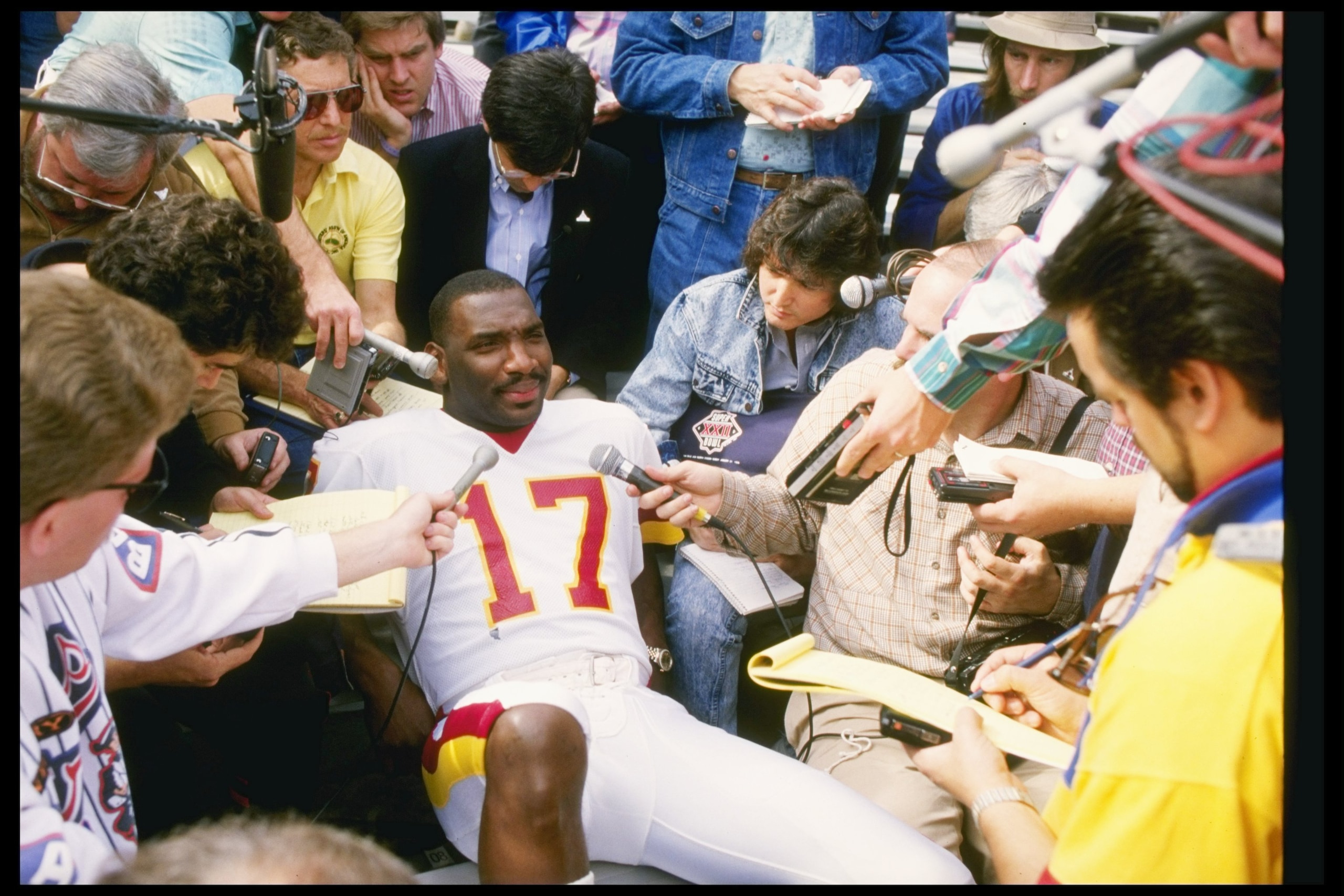 27 Jan 1988:  Quarterback Doug Williams of the Washington Redskins fields questions during Media Day for Super Bowl XXII against the Denver Broncos at Jack Murphy Stadium in San Diego, California.  The Redskins won the game, 42-10. Mandatory Credit: Mike