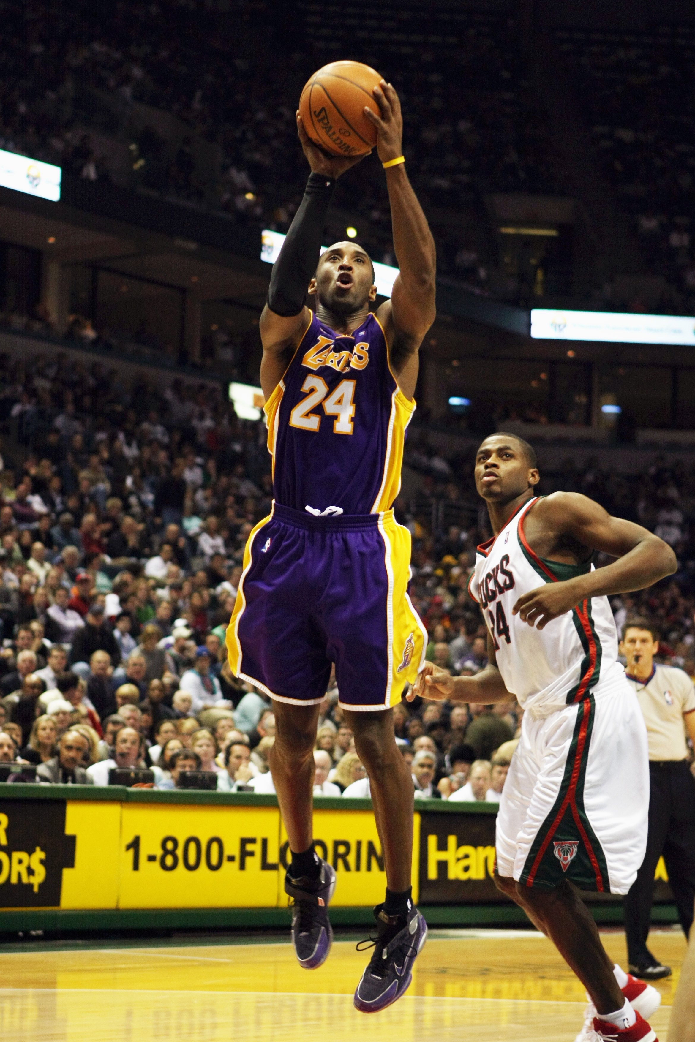 MILWAUKEE - NOVEMBER 21:  Kobe Bryant #24 of the Los Angeles Lakers goes up for a shot against Desmond Mason #24 of the Milwaukee Bucks during the game at the Bradley Center on November 21, 2007 in Milwaukee, Wisconsin.  The Bucks won 110-103.  NOTE TO US