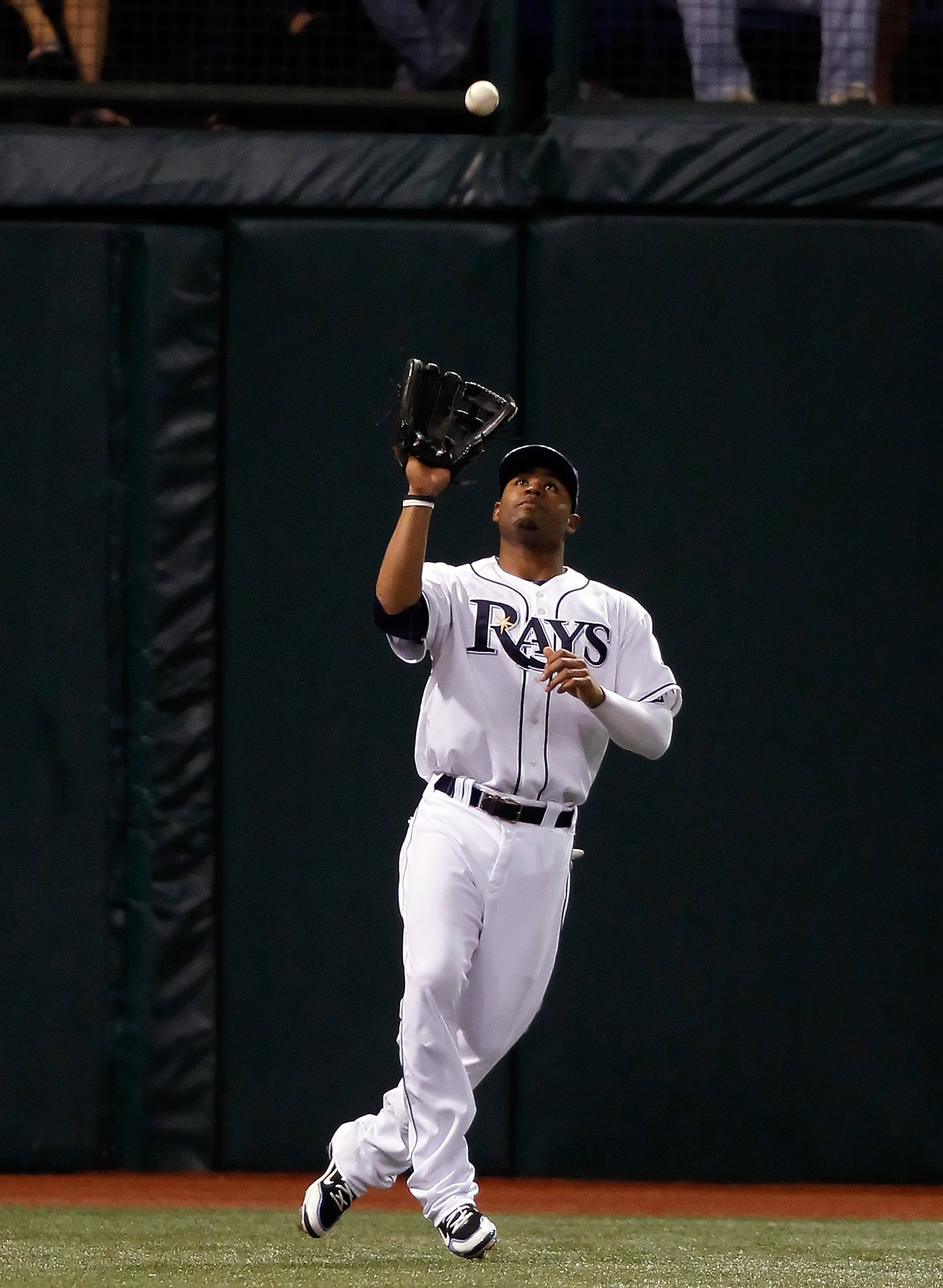 ST. PETERSBURG, FL - SEPTEMBER 29: Outfielder Carl Crawford #13 of the Tampa Bay Rays catches a fly ball against the Baltimore Orioles during the game at Tropicana Field on September 29, 2010 in St. Petersburg, Florida. (Photo by J. Meric/Getty Images) ST. PETERSBURG, FL - SEPTEMBER 29: Outfielder Carl Crawford #13 of the Tampa Bay Rays catches a fly ball against the Baltimore Orioles during the game at Tropicana Field on September 29, 2010 in St. Petersburg, Florida. (Photo by J. Meric/Getty Images)