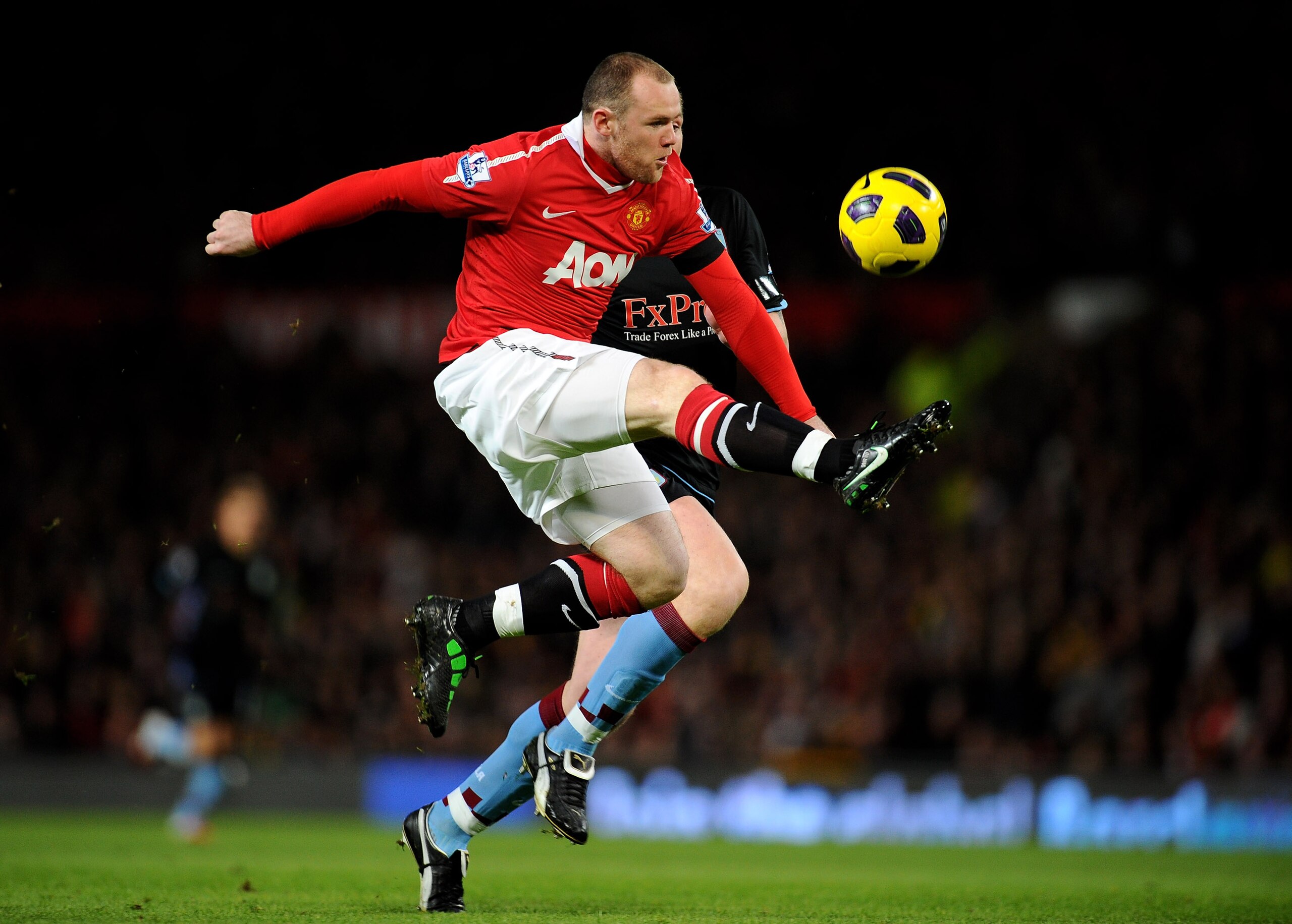 MANCHESTER, ENGLAND - FEBRUARY 01:  Wayne Rooney of Manchester United wins the ball prior to scoring the opening goal during the Barclays Premier League match between Manchester United and Aston Villa at Old Trafford on February 1, 2011 in Manchester, Eng