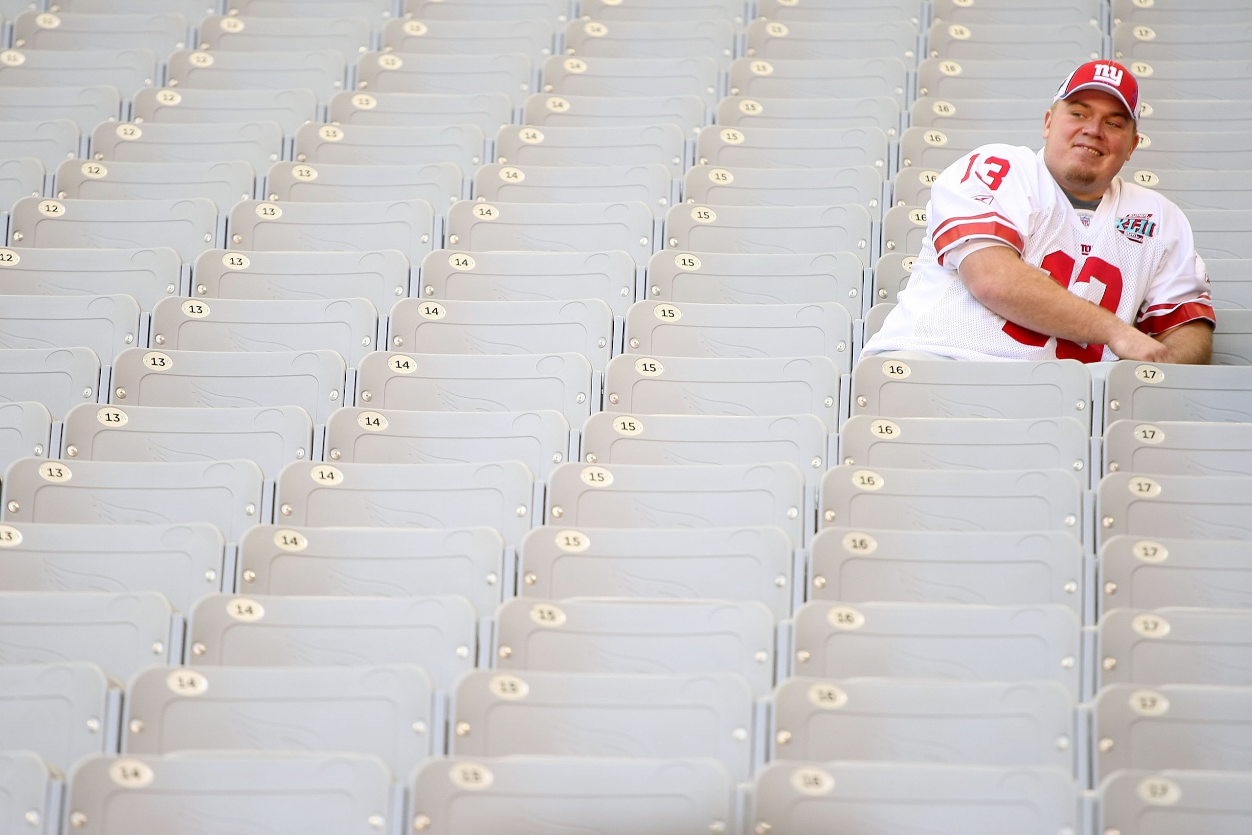 GLENDALE, AZ - JANUARY 29:  Quarterback Jared Lorenzen #13 of the New York Giants sits in the stands during Giants media day for Super Bowl XLII at University of Phoenix Stadium on January 29, 2008 in Glendale, Arizona.  (Photo by Scott Halleran/Getty Ima