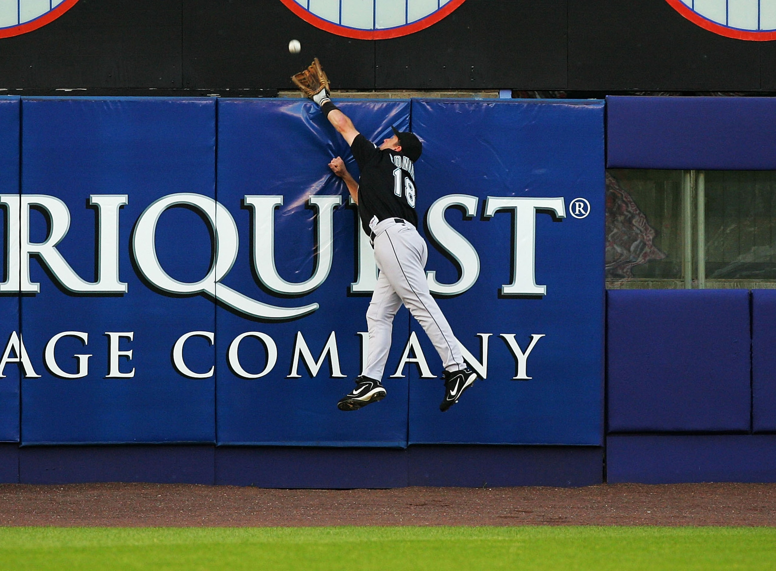 NEW YORK - JULY 19: Jeff Conine #18 of the Florida Marlins leaps but can not catch a three-run home run hit by Shane Spencer #43 of the New York Mets on July 19, 2004, at Shea Stadium in Flushing, New York. (Photo by Ezra Shaw/Getty Images) NEW YORK - JULY 19: Jeff Conine #18 of the Florida Marlins leaps but can not catch a three-run home run hit by Shane Spencer #43 of the New York Mets on July 19, 2004, at Shea Stadium in Flushing, New York. (Photo by Ezra Shaw/Getty Images)
