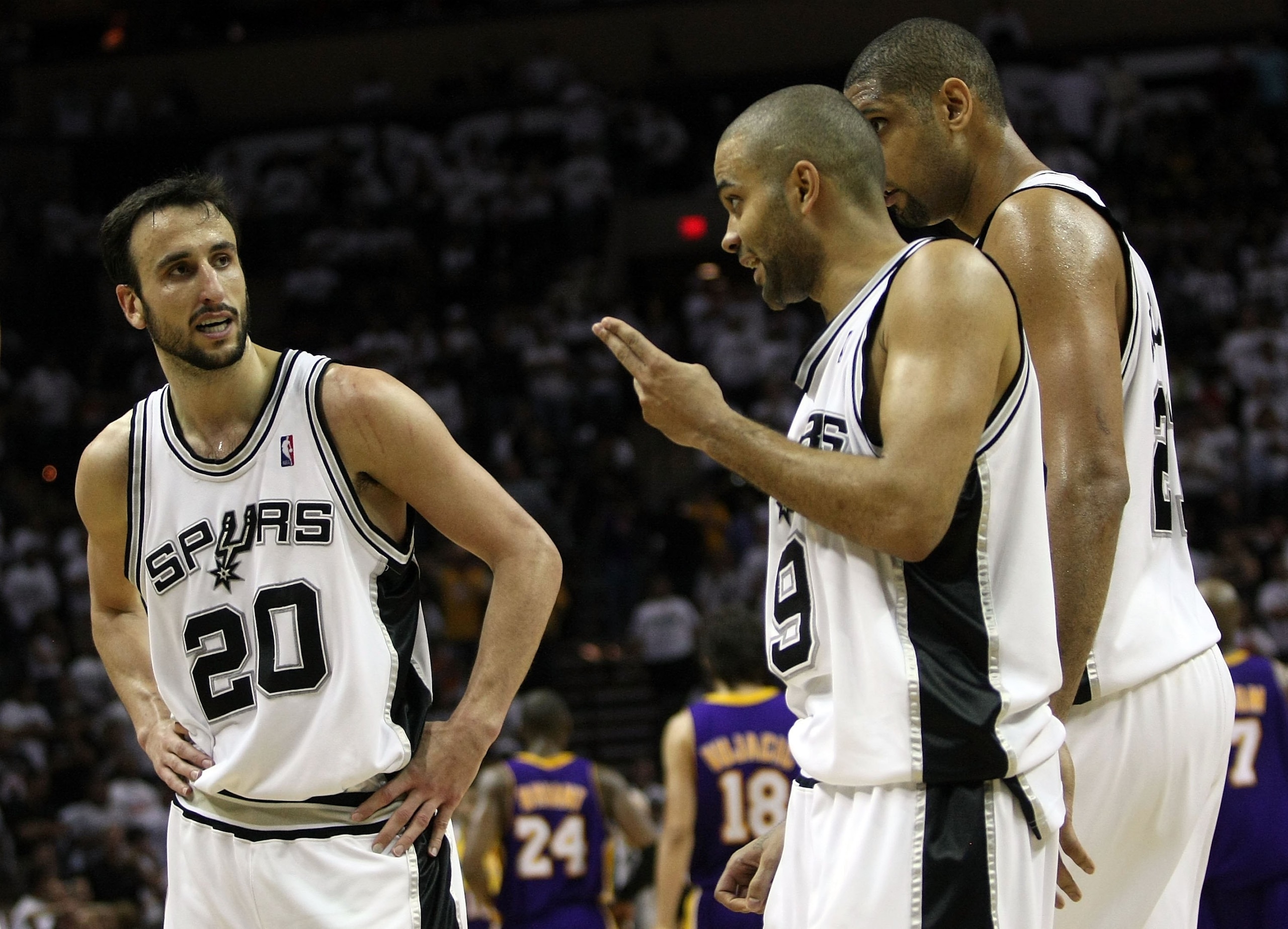 SAN ANTONIO - MAY 27:  (M) Tony Parker #9 and Manu Ginobili #20 of the San Antonio Spurs talk while Tim Duncan #21 stands alongside while taking on the Los Angeles Lakers in Game Four of the Western Conference Finals during the 2008 NBA Playoffs on May 27