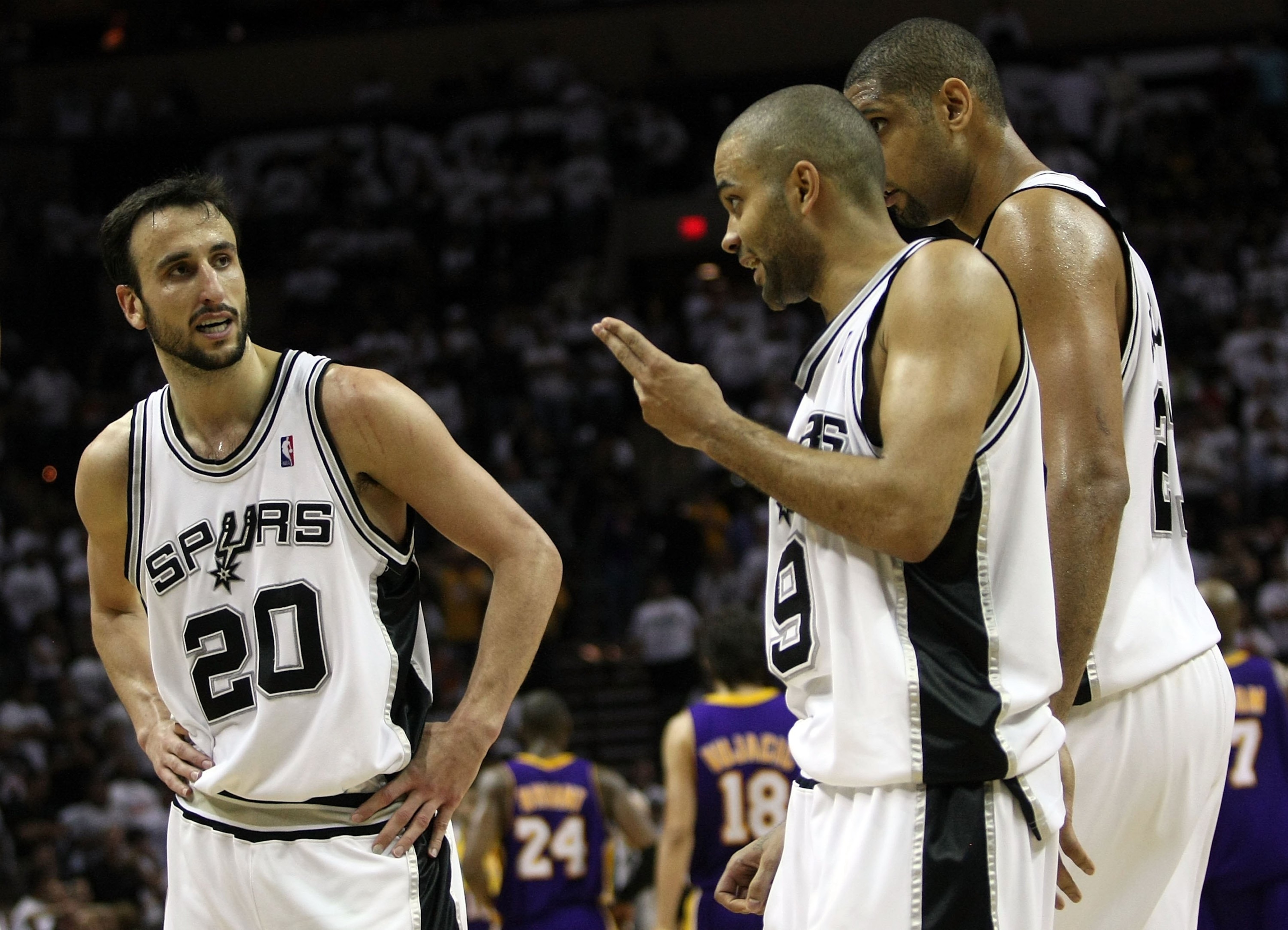 SAN ANTONIO - MAY 27:  (M) Tony Parker #9 and Manu Ginobili #20 of the San Antonio Spurs talk while Tim Duncan #21 stands alongside while taking on the Los Angeles Lakers in Game Four of the Western Conference Finals during the 2008 NBA Playoffs on May 27