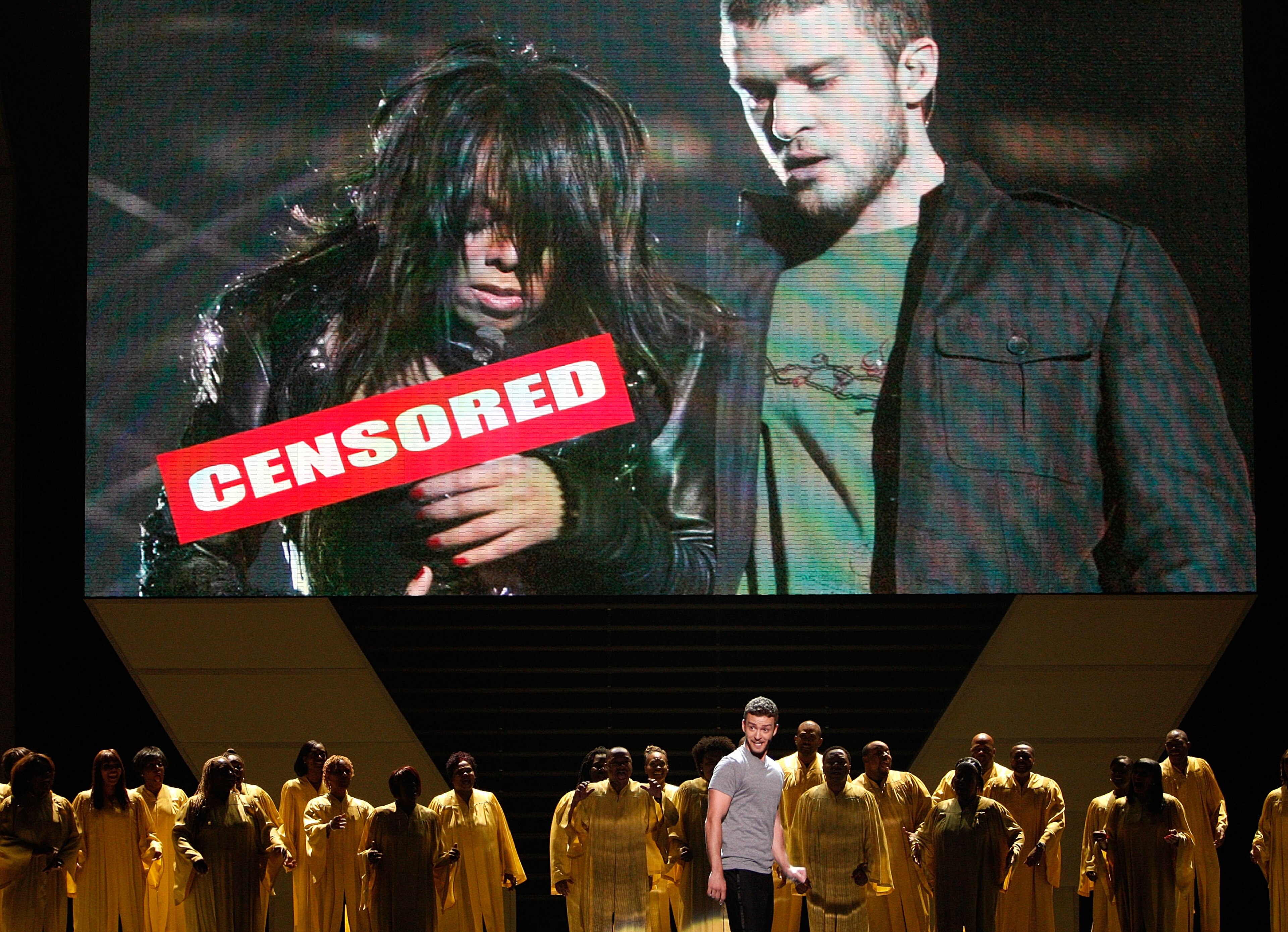 LOS ANGELES, CA - JULY 16:  Host Justin Timberlake stands onstage in front of a video of himself and Janet Jackson from Super Bowl XXXVIII onstage at the 2008 ESPY Awards held at NOKIA Theatre L.A. LIVE on July 16, 2008 in Los Angeles, California.  The 20