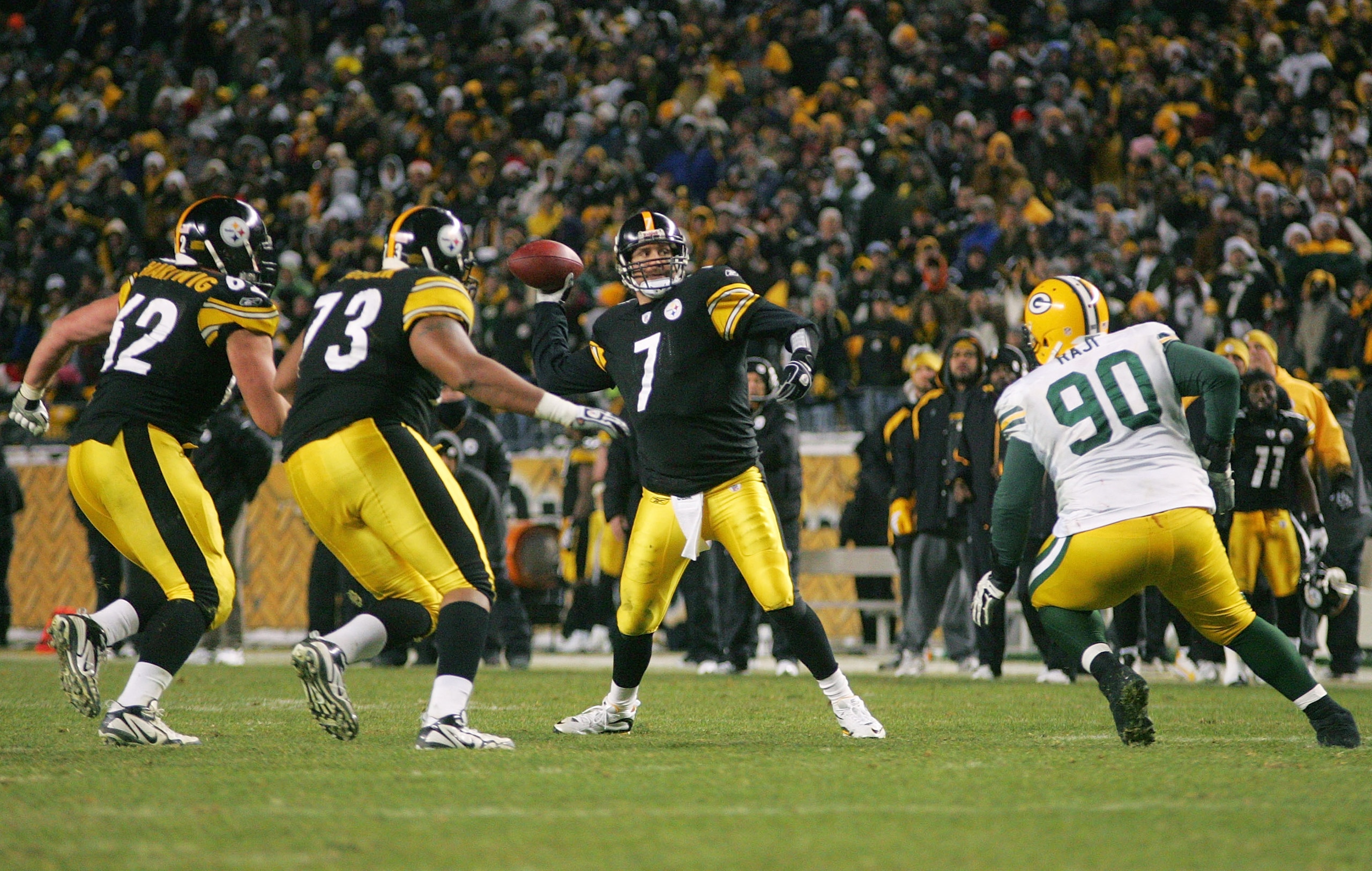 PITTSBURGH - DECEMBER 20: Ben Roethlisberger #7 of the Pittsburgh Steelers throws the game winning touchdown pass in the fourth quarter in front of BJ Raji #90 of the Green Bay Packers during the game on December 20, 2009 at Heinz Field in Pittsburgh, Pen