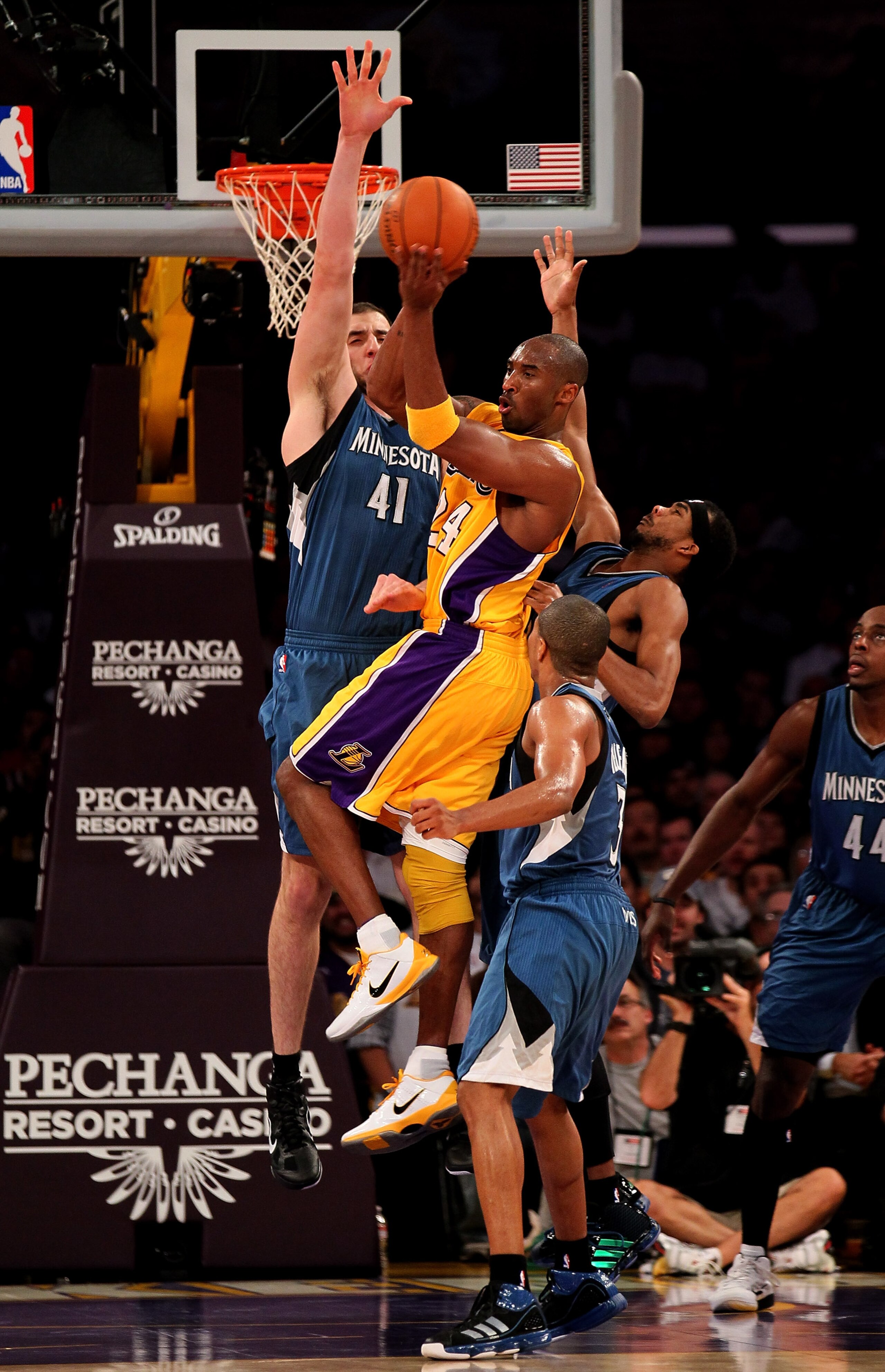 LOS ANGELES, CA - NOVEMBER 09:  Kobe Bryant #24 of the Los Angeles Lakers passes off the ball over Sebastian Telfair #3, Corey Brewer #22, and Kosta Koufos #41 of the Minnesota Timberwolves at Staples Center on November 9, 2010 in Los Angeles, California.