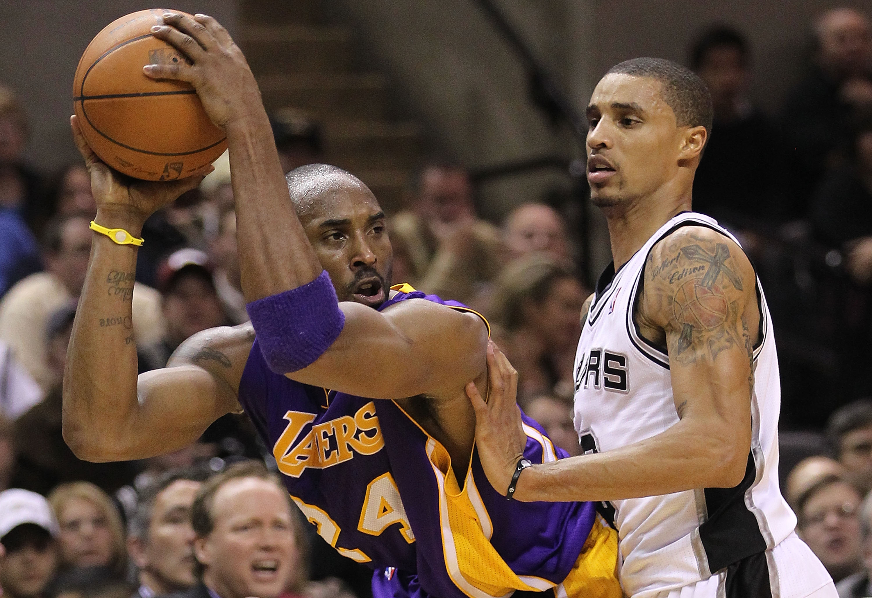 SAN ANTONIO, TX - DECEMBER 28:  Guard Kobe Bryant #24 of the Los Angeles Lakers dribbles the ball against George Hill #3 of the San Antonio Spurs at AT&T Center on December 28, 2010 in San Antonio, Texas.  NOTE TO USER: User expressly acknowledges and agr