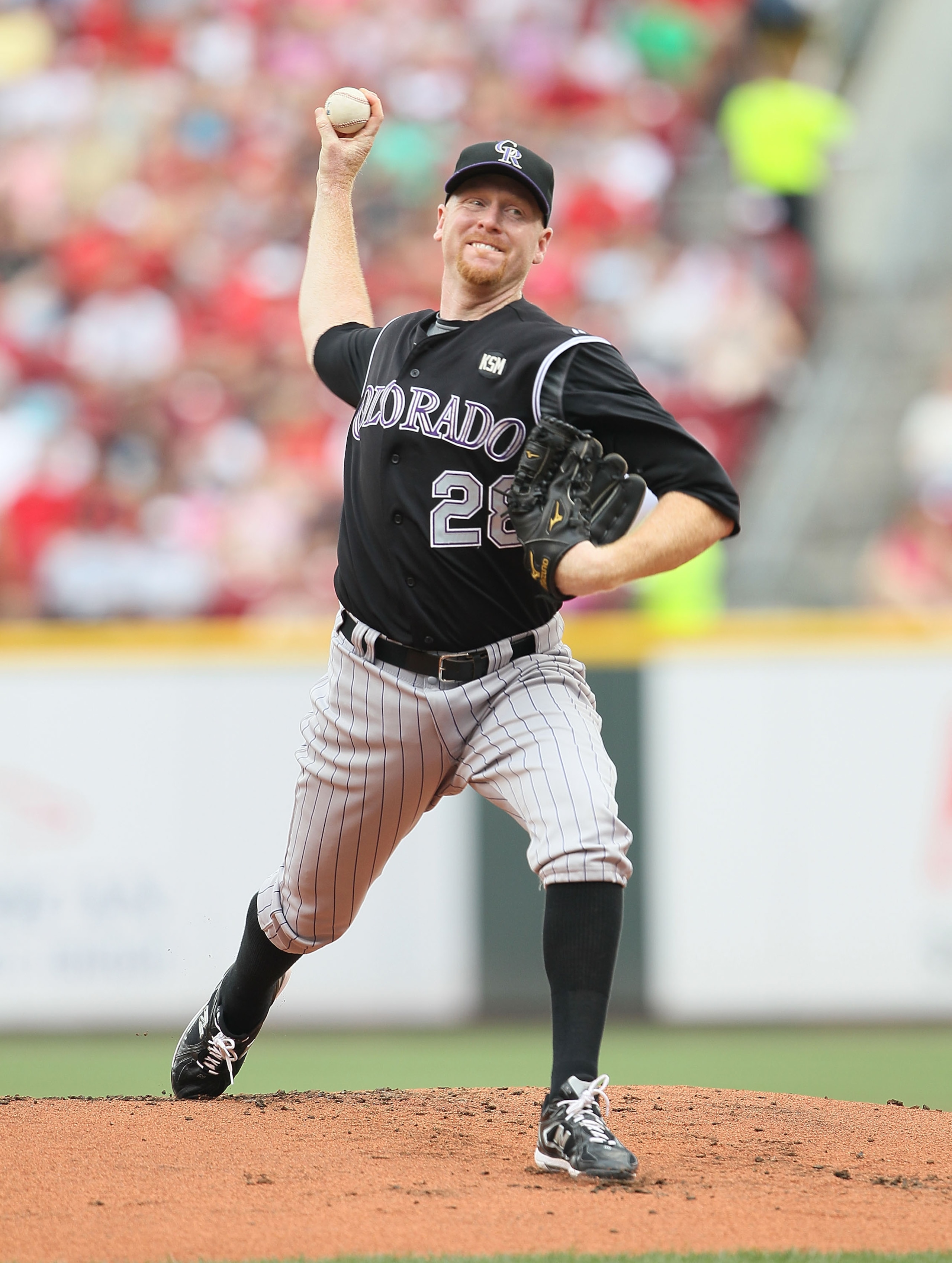 CINCINNATI - JULY 18:  Aaron Cook #28 of the Colorado Rockies throws a pitch during the game against the Cincinnati Reds at Great American Ball Park on July 18, 2010 in Cincinnati, Ohio.  (Photo by Andy Lyons/Getty Images)