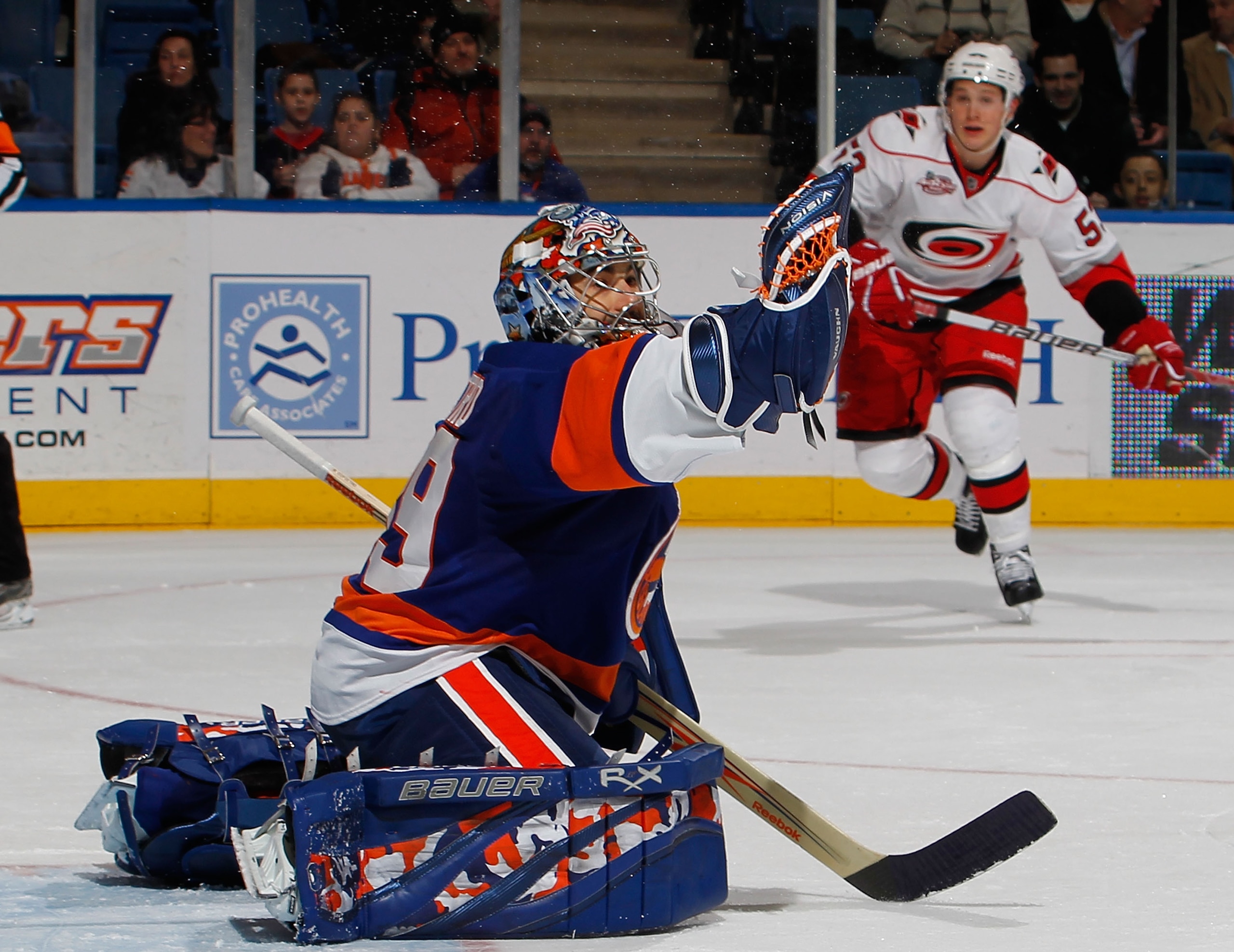 UNIONDALE, NY - JANUARY 26: Jeff Skinner #53 of the Carolina Hurricanes skates toward the goal as goalie Rick DiPietro #39 of the New York Islanders catches a shot from the point during the third period of an NHL hockey game at the Nassau Coliseum on Jan UNIONDALE, NY - JANUARY 26: Jeff Skinner #53 of the Carolina Hurricanes skates toward the goal as goalie Rick DiPietro #39 of the New York Islanders catches a shot from the point during the third period of an NHL hockey game at the Nassau Coliseum on Jan