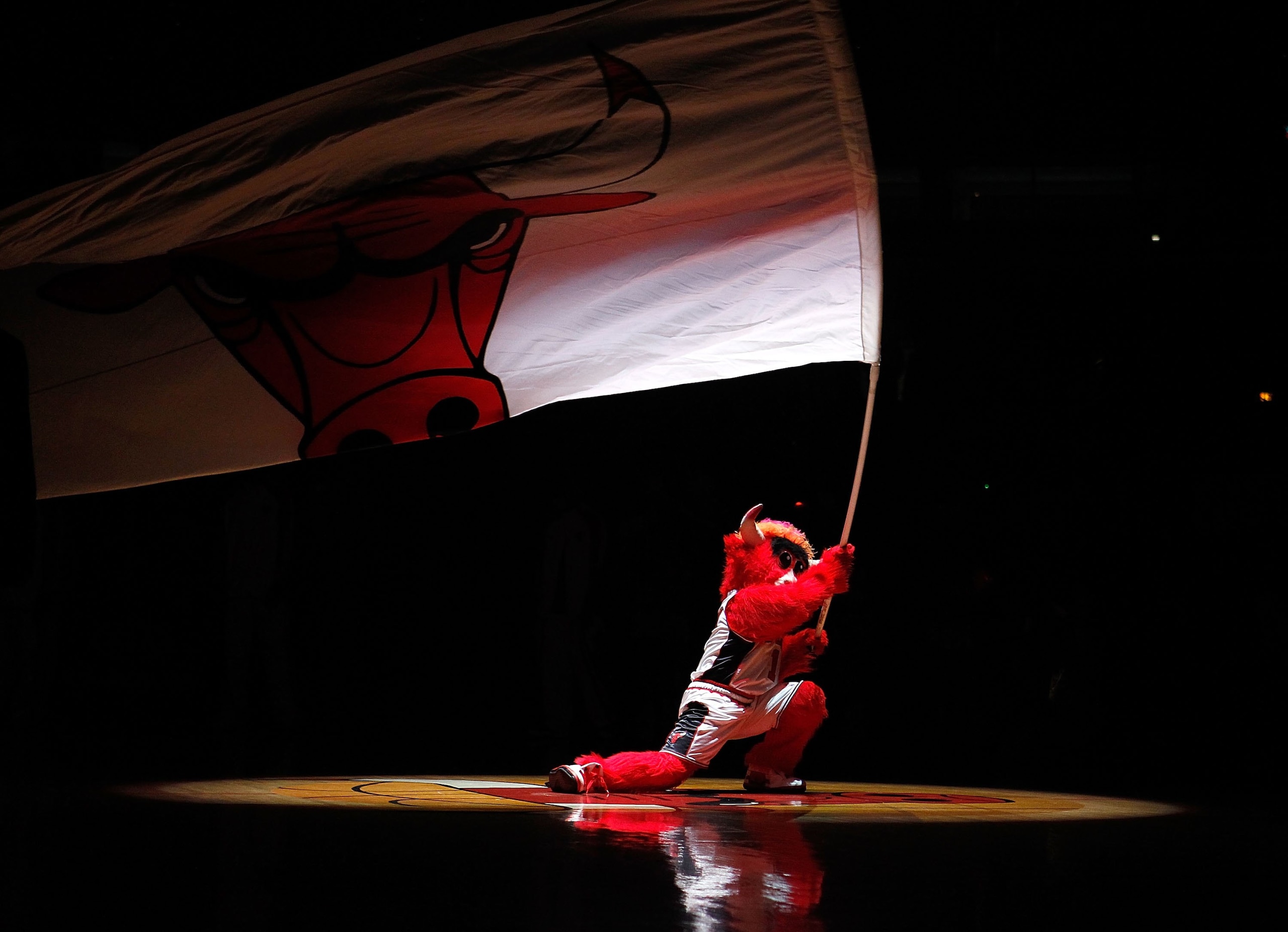 CHICAGO - MARCH 01: Benny, the mascot of the Chicago Bulls, waves a flag during player introductions before a game between the Bulls and the Atlanta Hawks at the United Center on March 1, 2010 in Chicago, Illinois. NOTE TO USER: User expressly acknowledge