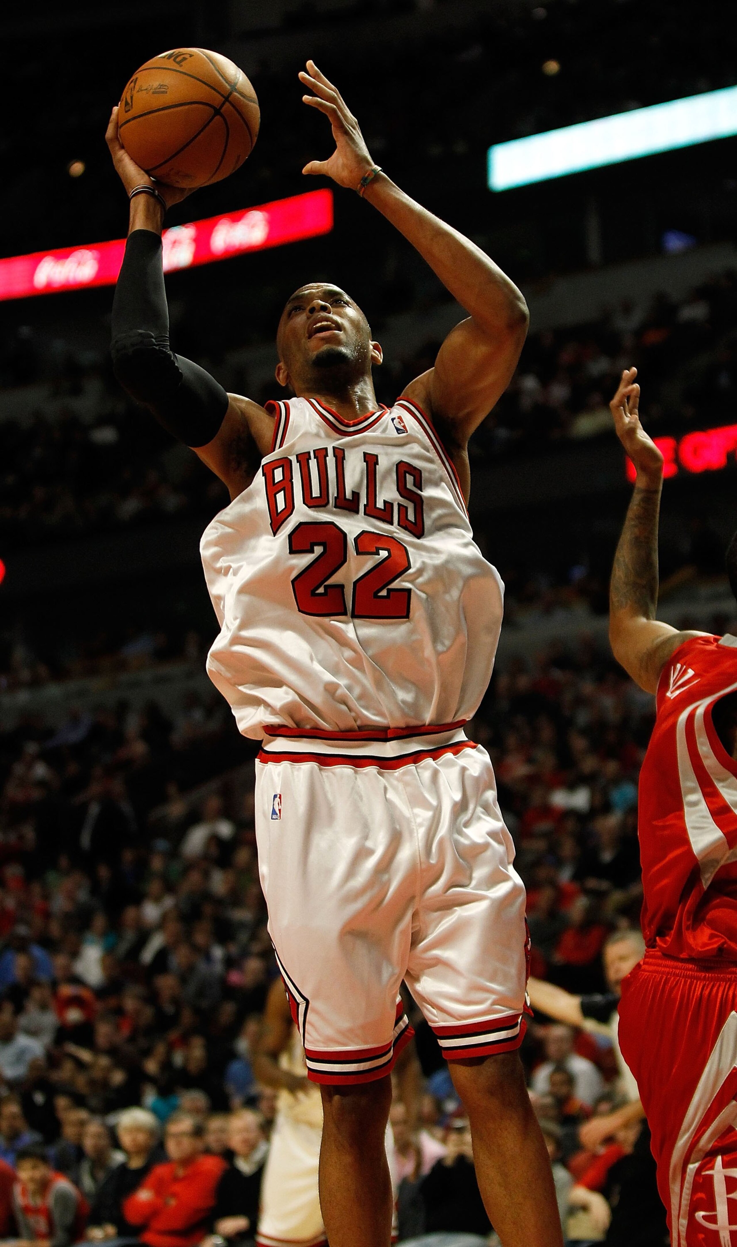 CHICAGO - MARCH 22: Taj Gibson #22 of the Chicago Bulls grabs a rebound the Houston Rockets at the United Center on March 22, 2010 in Chicago, Illinois. The Bulls defeated the Rockets 98-88. NOTE TO USER: User expressly acknowledges and agrees that, by do CHICAGO - MARCH 22: Taj Gibson #22 of the Chicago Bulls grabs a rebound the Houston Rockets at the United Center on March 22, 2010 in Chicago, Illinois. The Bulls defeated the Rockets 98-88. NOTE TO USER: User expressly acknowledges and agrees that, by do