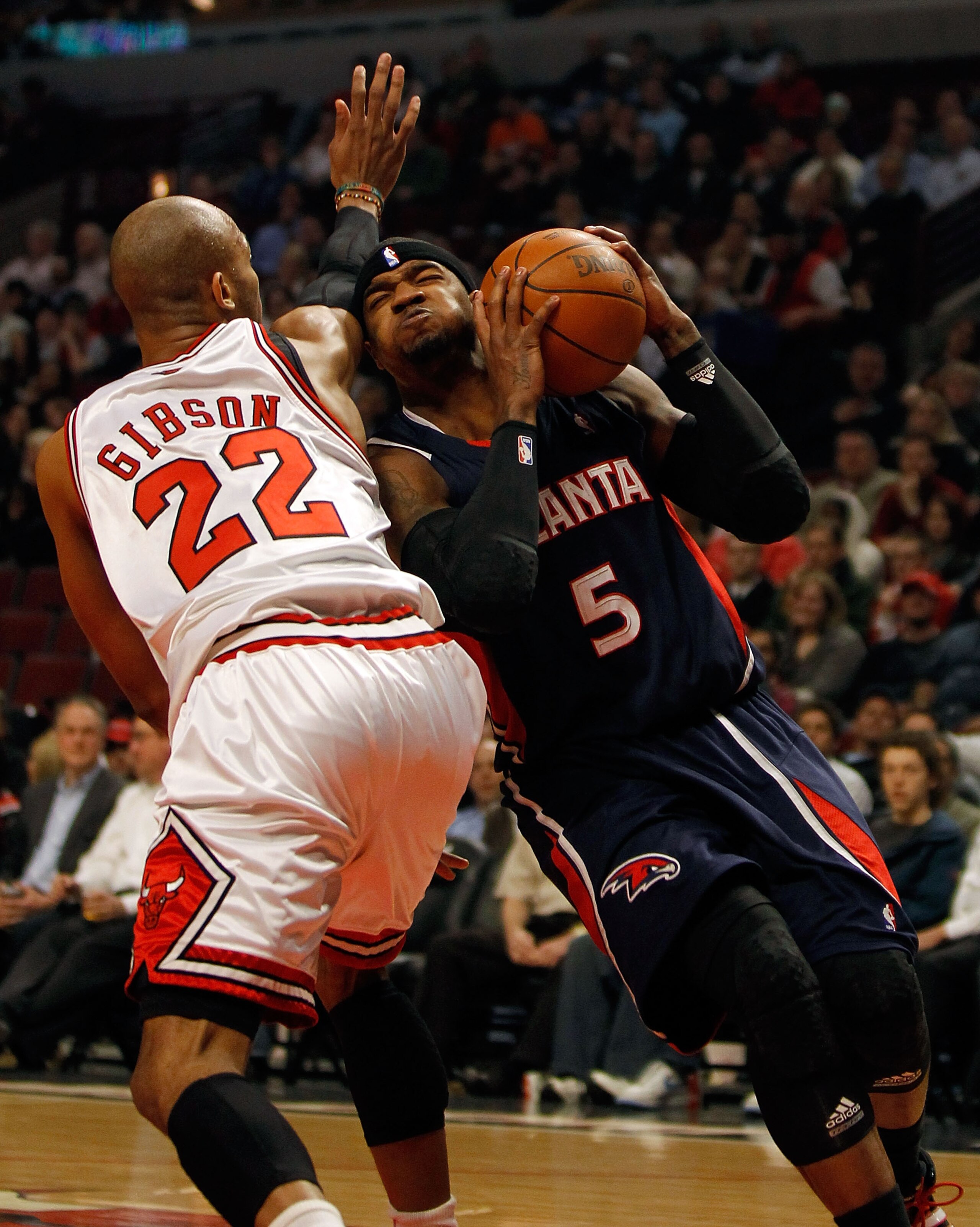 CHICAGO - MARCH 01: Josh Smith #5 of the Atlanta Hawks drives against Taj Gibson #22 of the Chicago Bulls at the United Center on March 1, 2010 in Chicago, Illinois. NOTE TO USER: User expressly acknowledges and agrees that, by downloading and/or using th